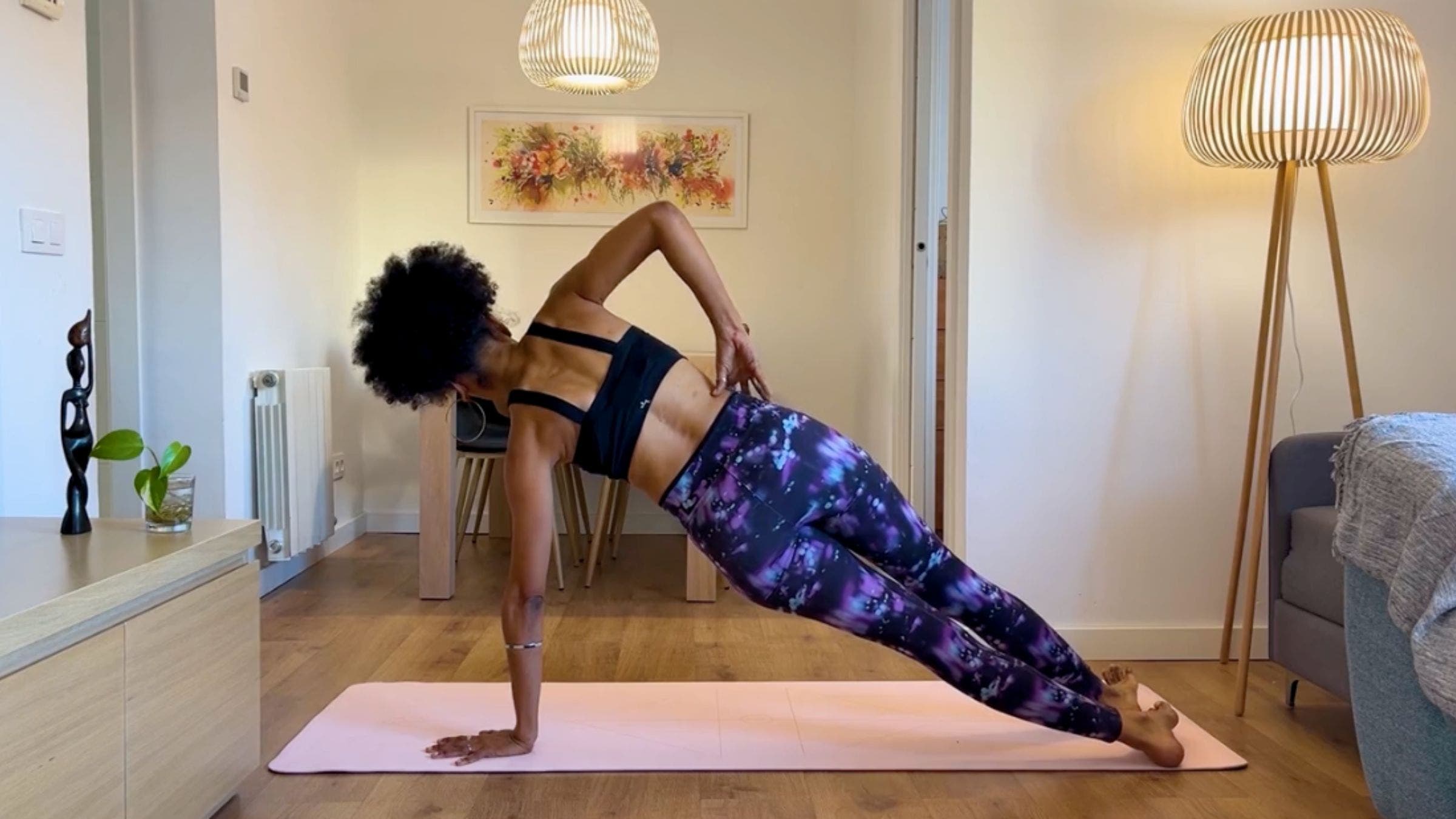 Yoga teacher practicing Side Plank.