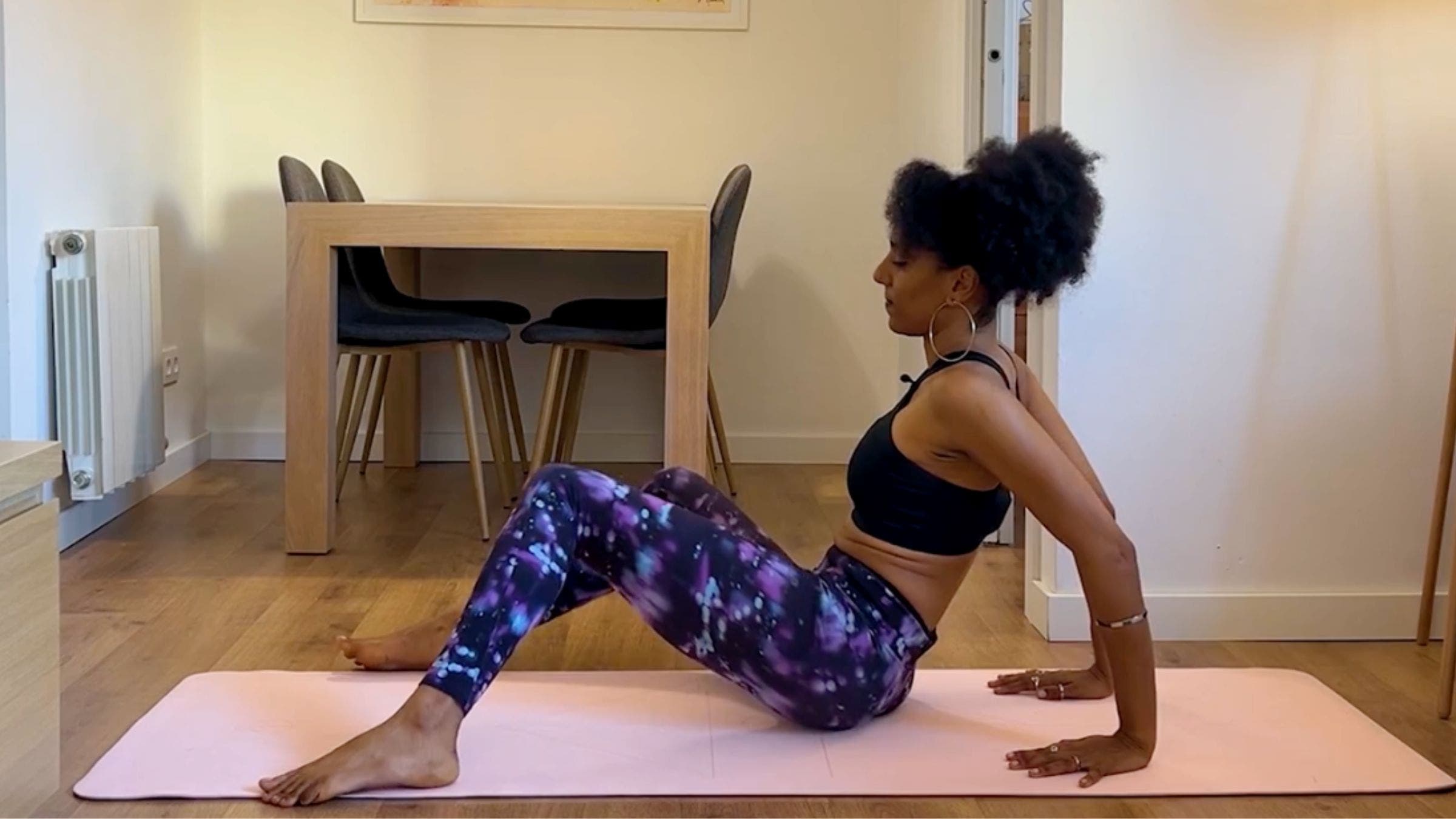 Yoga teacher practicing windshield wipers.