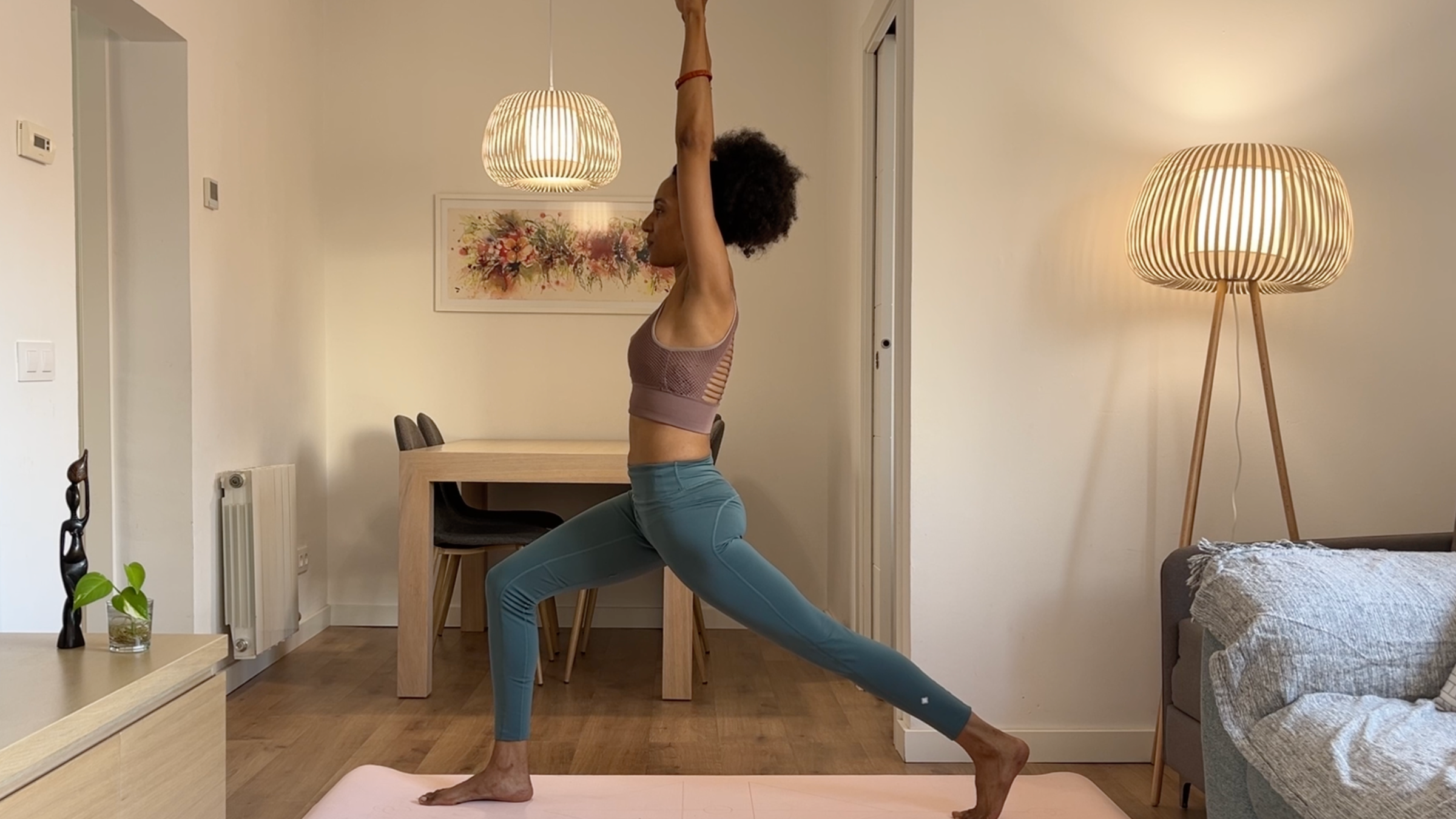 Yoga teacher practicing High Lunge.