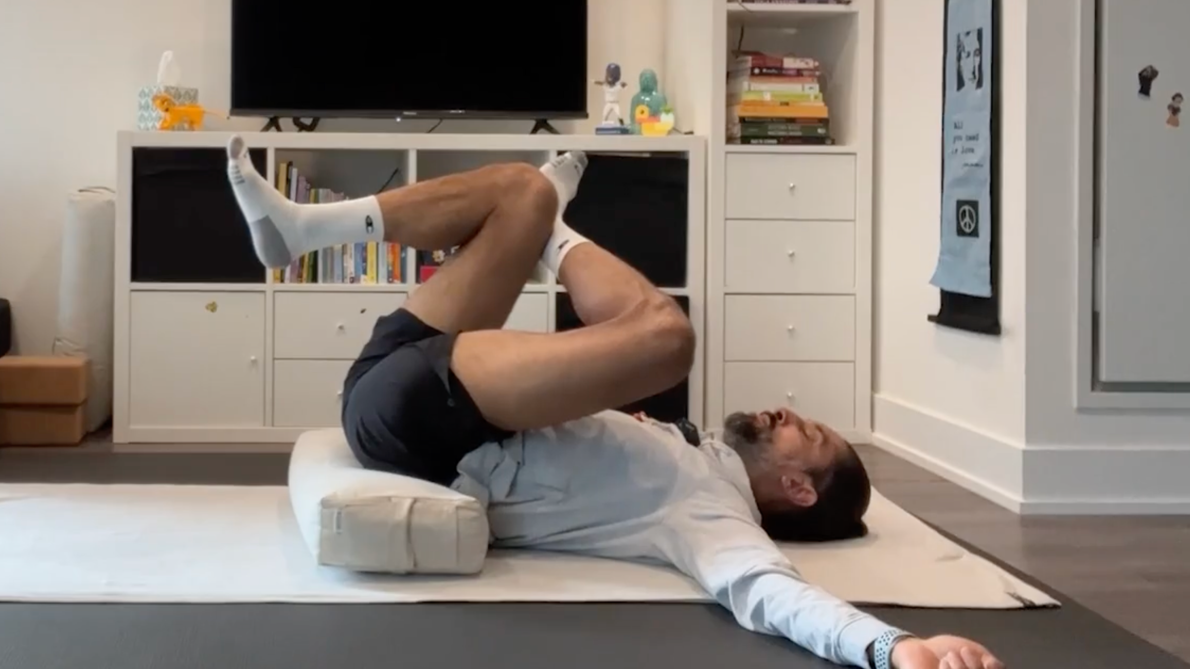 Yoga teacher Jaffer Hussain in a Thread the Needle Variation, part of his bedtime yoga practice