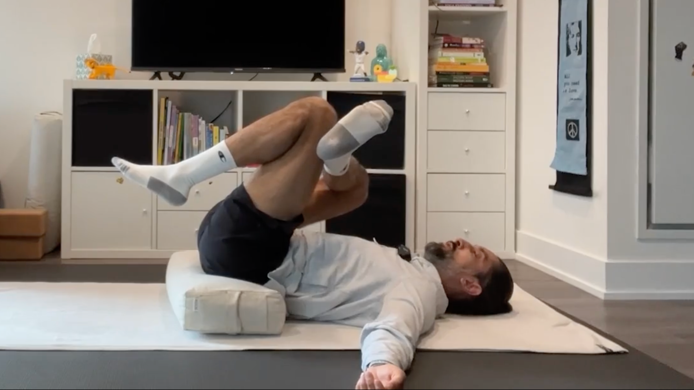 Yoga teacher Jaffer Hussain in a Thread the Needle Variation, part of his bedtime yoga practice