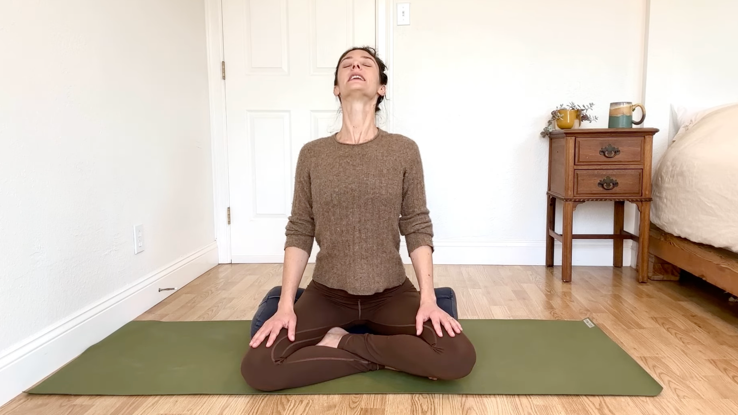 15-Minute Yoga to Ease Stress and Slow Down—Without Standing Up