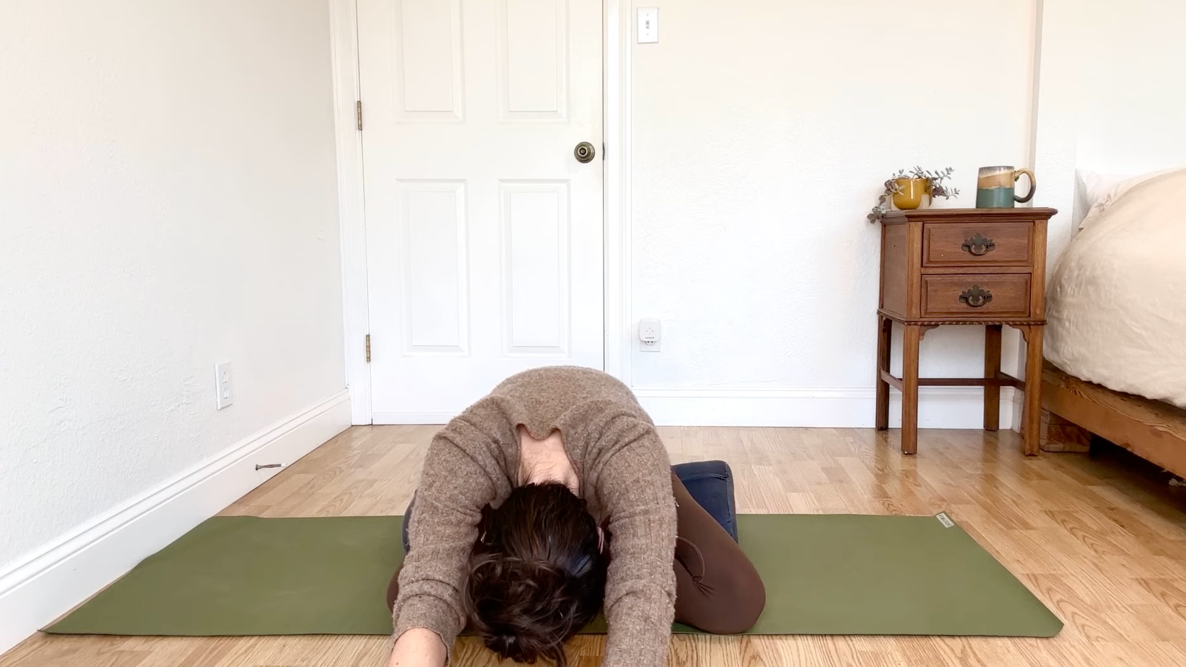 15-Minute Yoga to Ease Stress and Slow Down—Without Standing Up