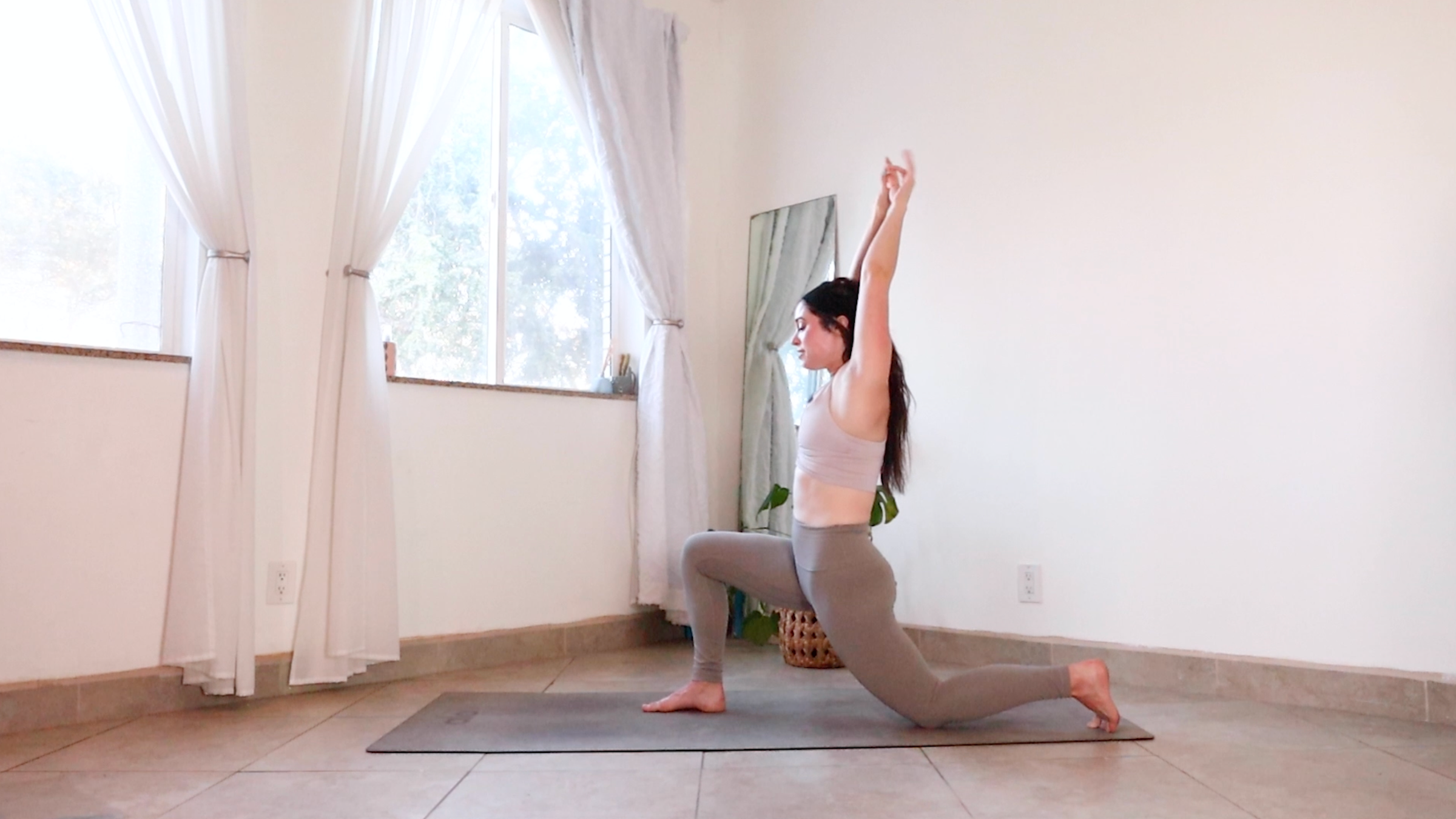Yoga teacher Daria LeGrand in Low Cresent Lunge, part of her morning yoga practice