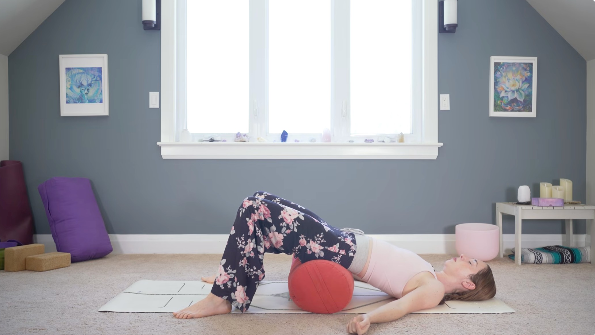 Woman practicing Supported Bridge during yin yoga for exhaustion