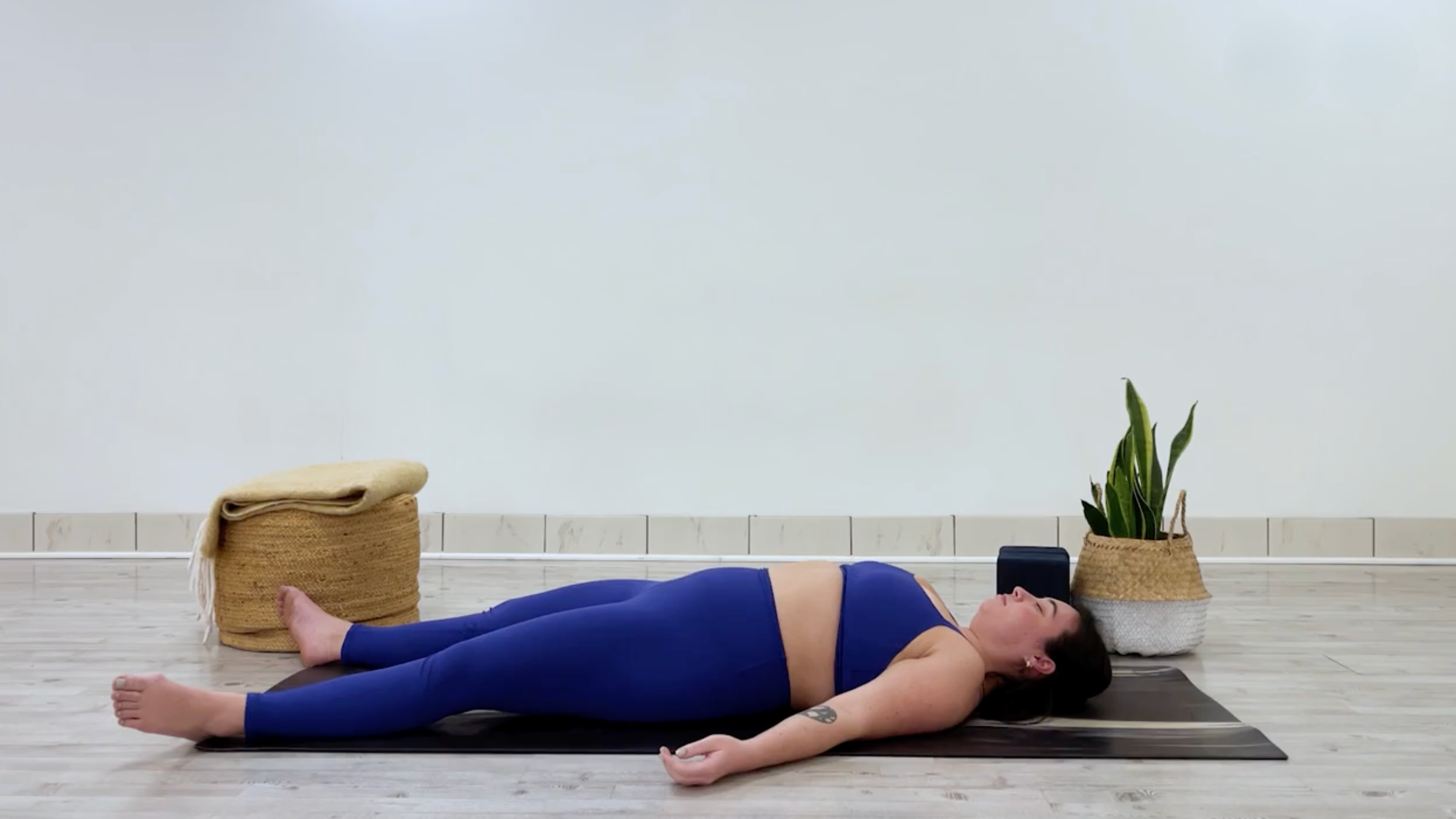 Teacher Taylor Lorenz in Savasana