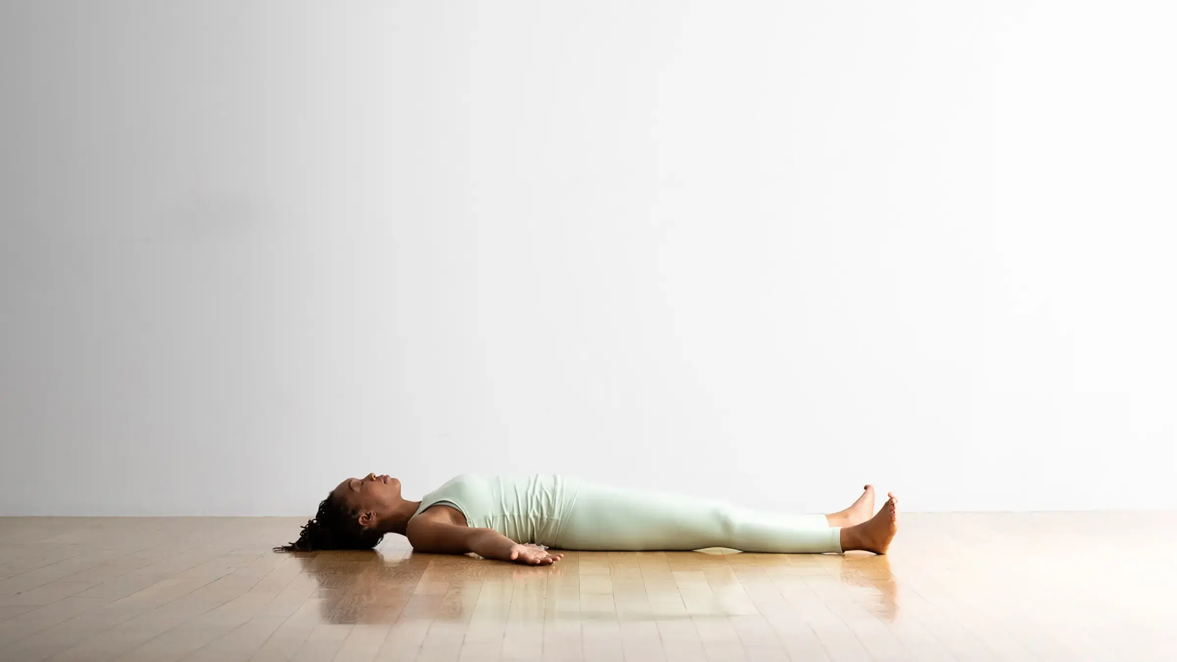 A woman in Savasana