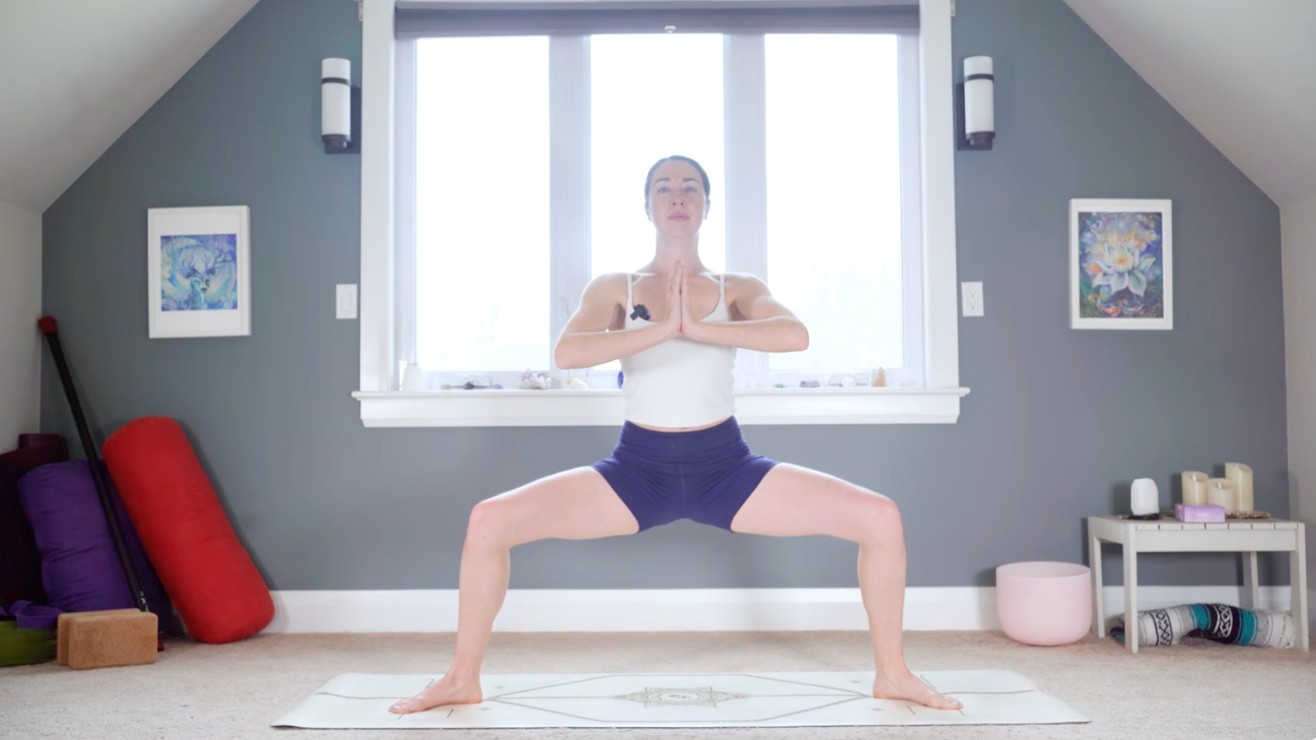 Woman with bent knees while standing in Goddess Pose