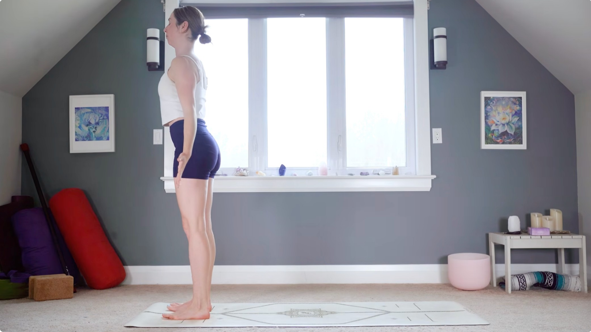 Woman standing in Mountain Pose at the top during 15-minute morning yoga routine