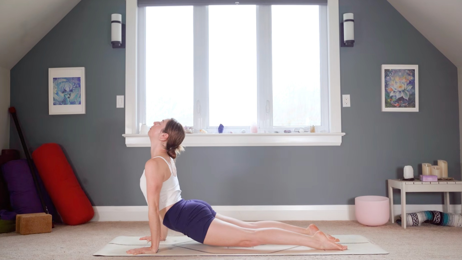 Woman with her hands and tops of her feet on the mat in Upward-Facing Dog