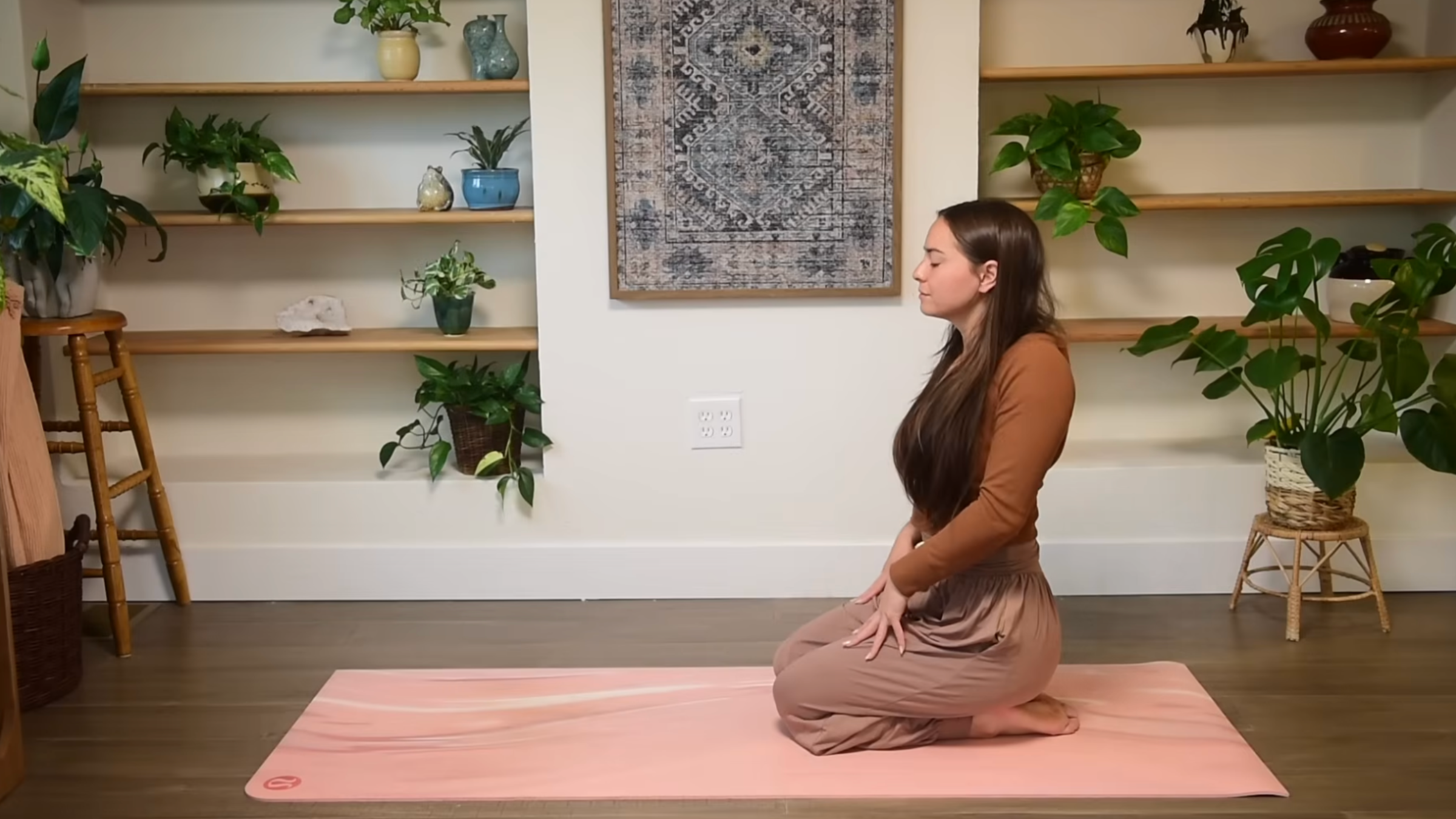 Yoga teacher practicing Shoulder Circles.
