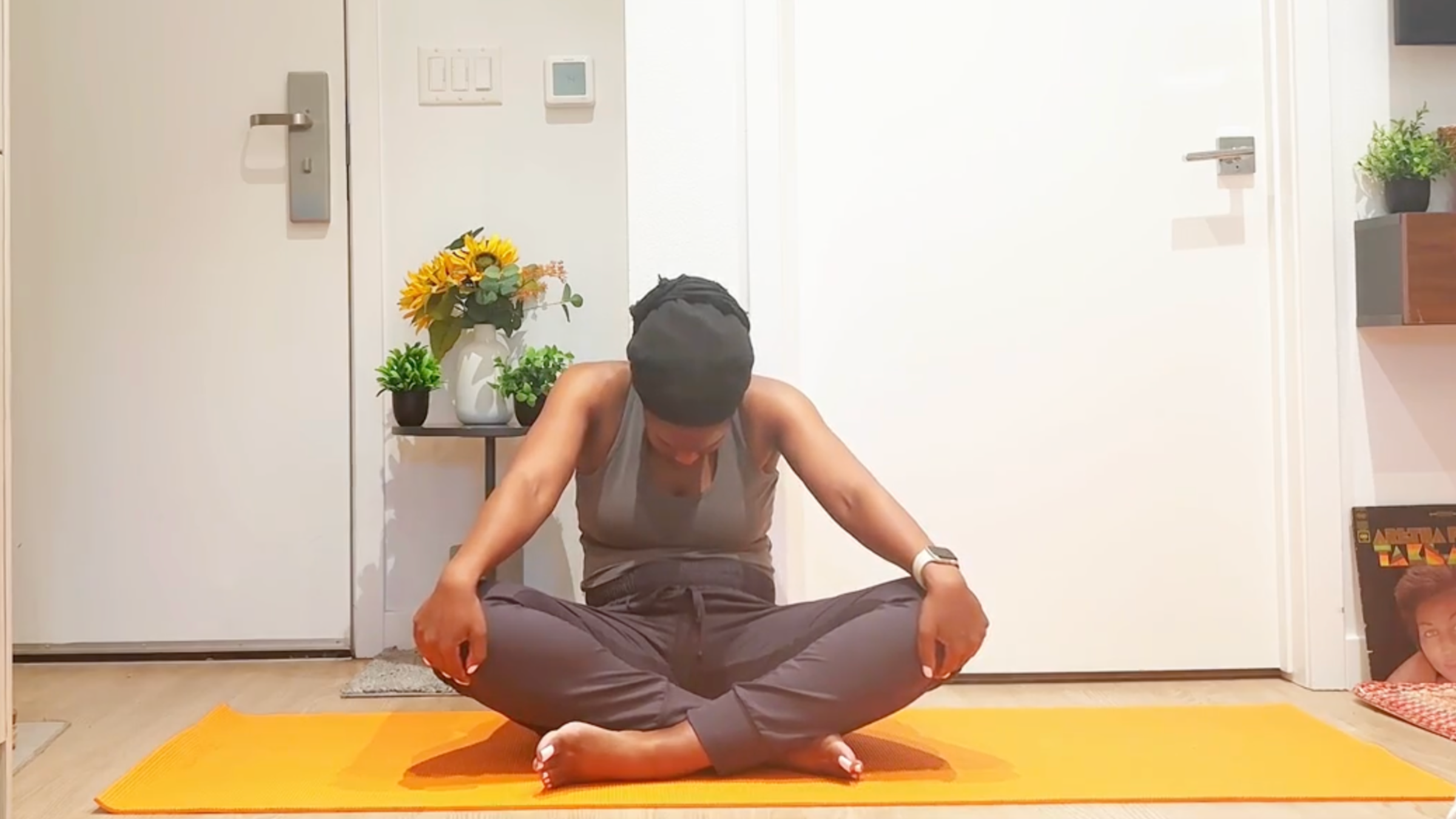 Ramoni Overton practicing Seated Cat stretch.