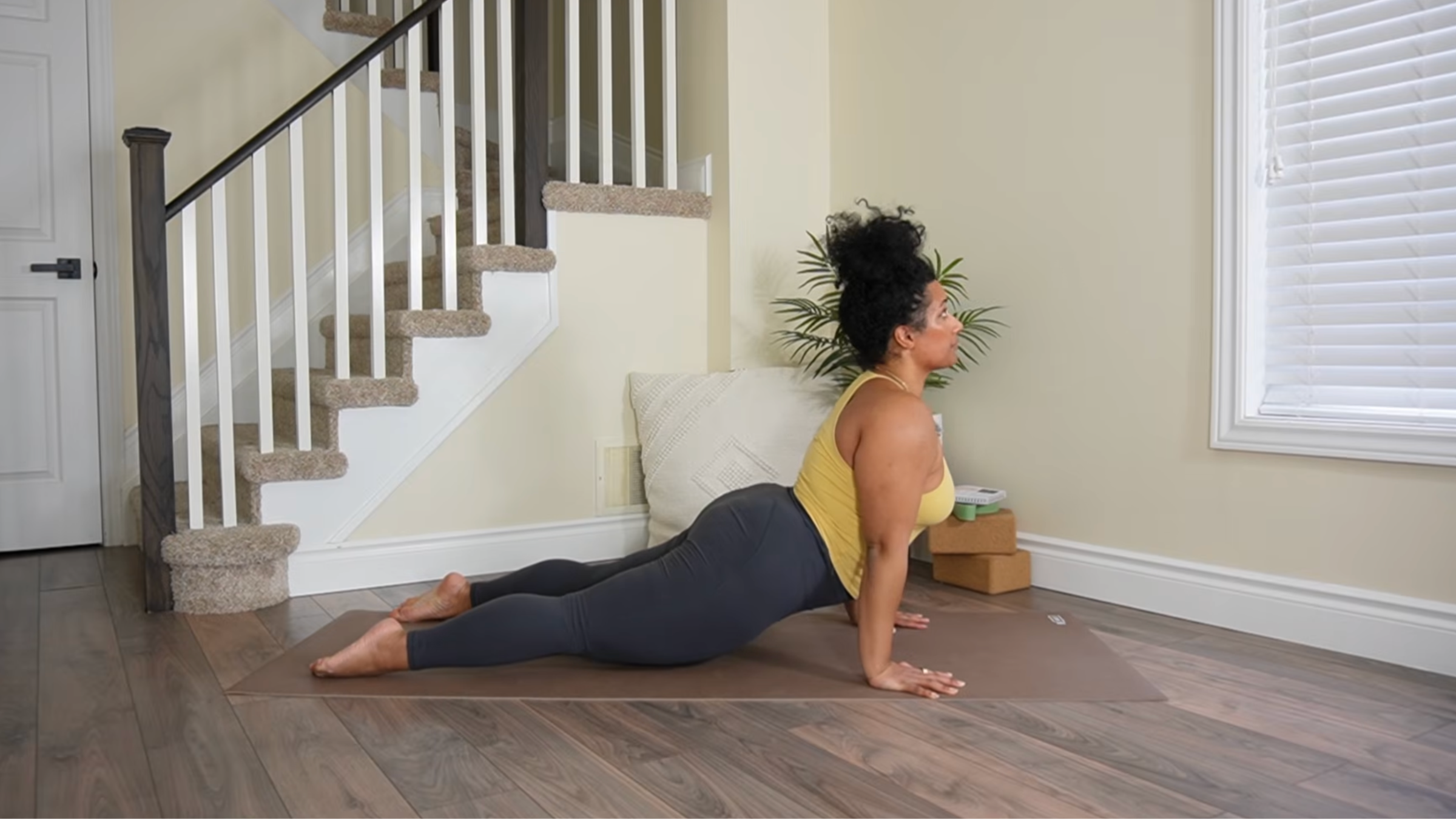 Yoga teacher practicing Upward Dog.