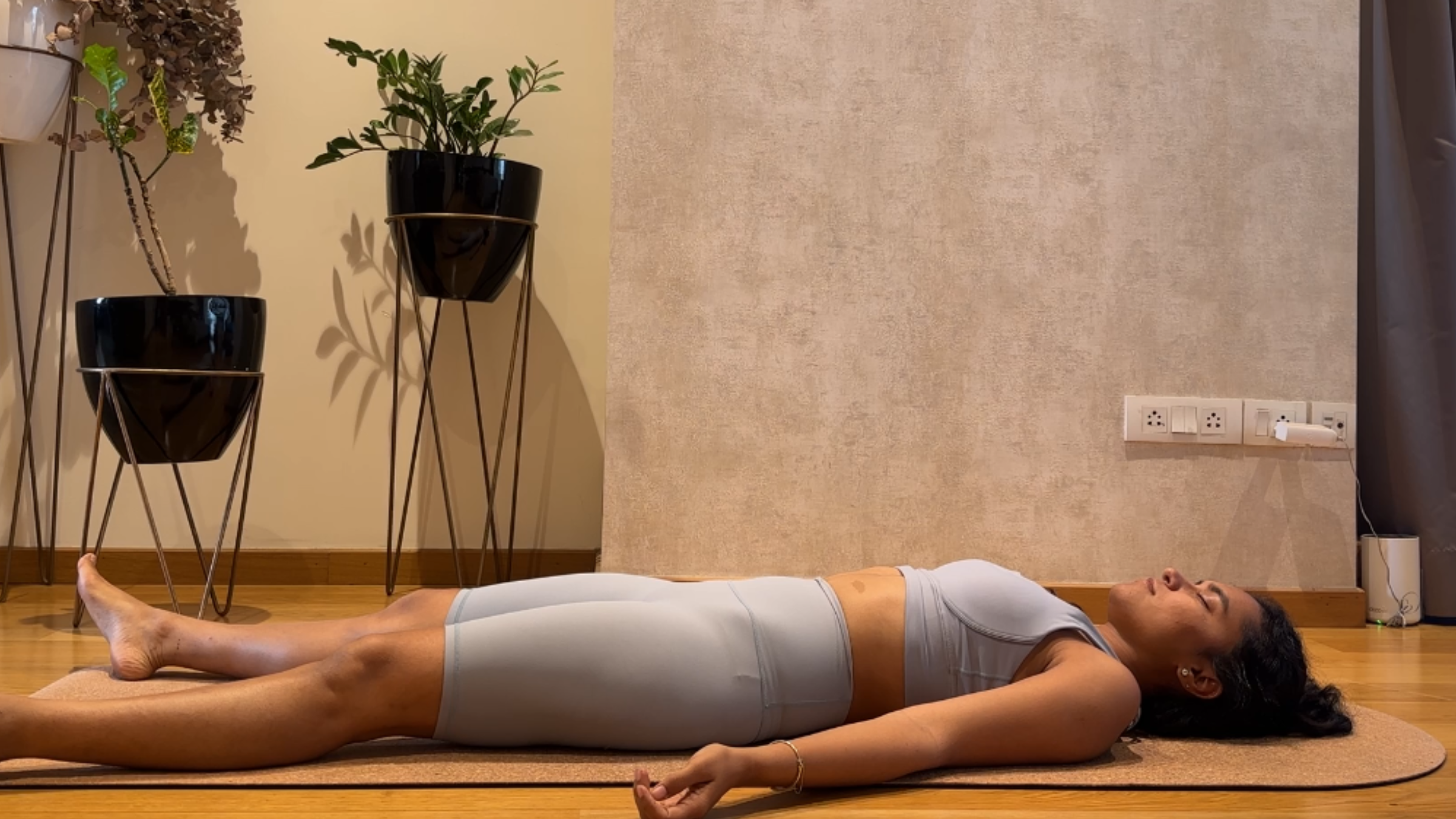 Riya Davda practicing Savasana.