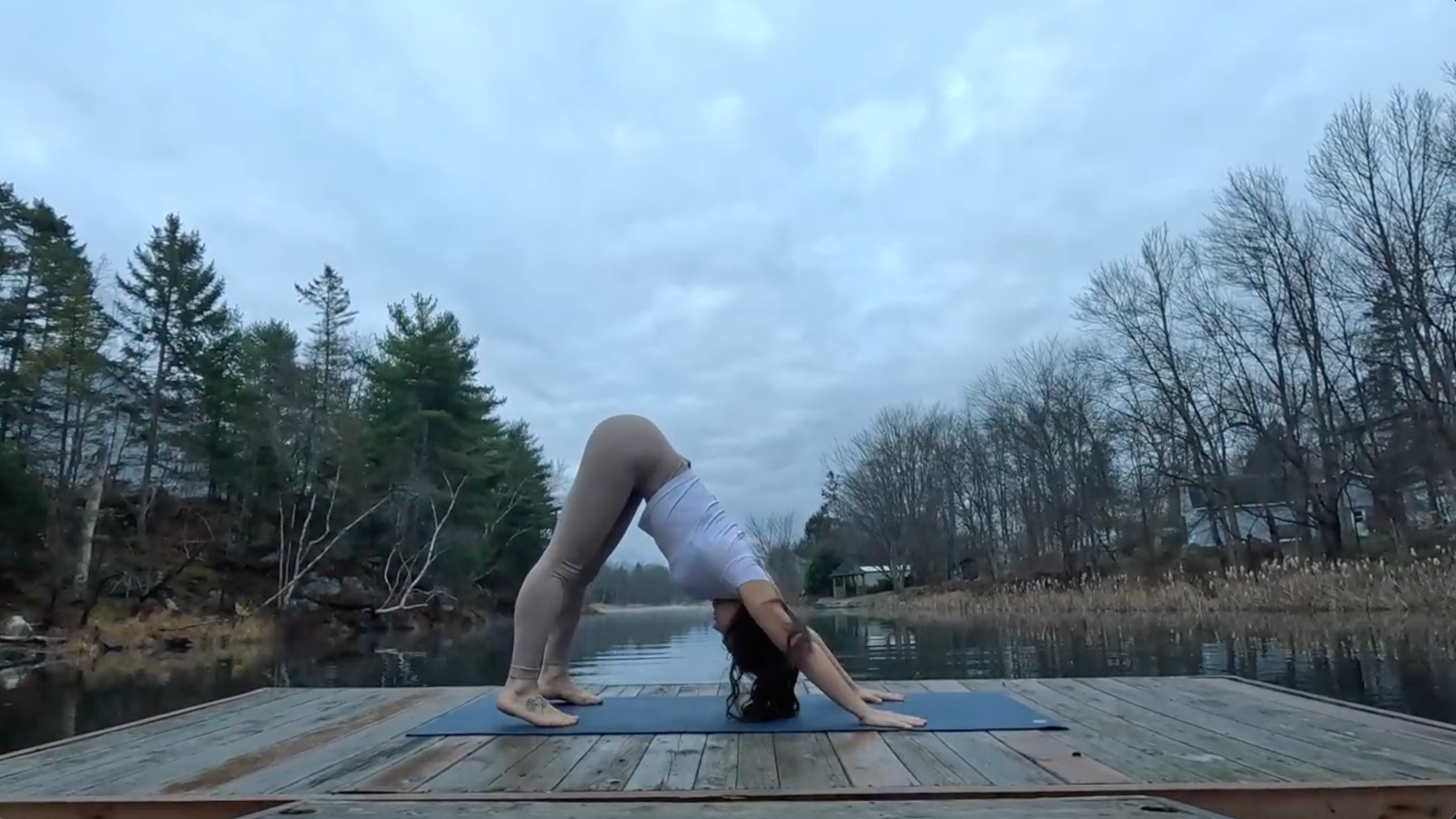 Teacher Emily Baltzer in Downward-Facing Dog