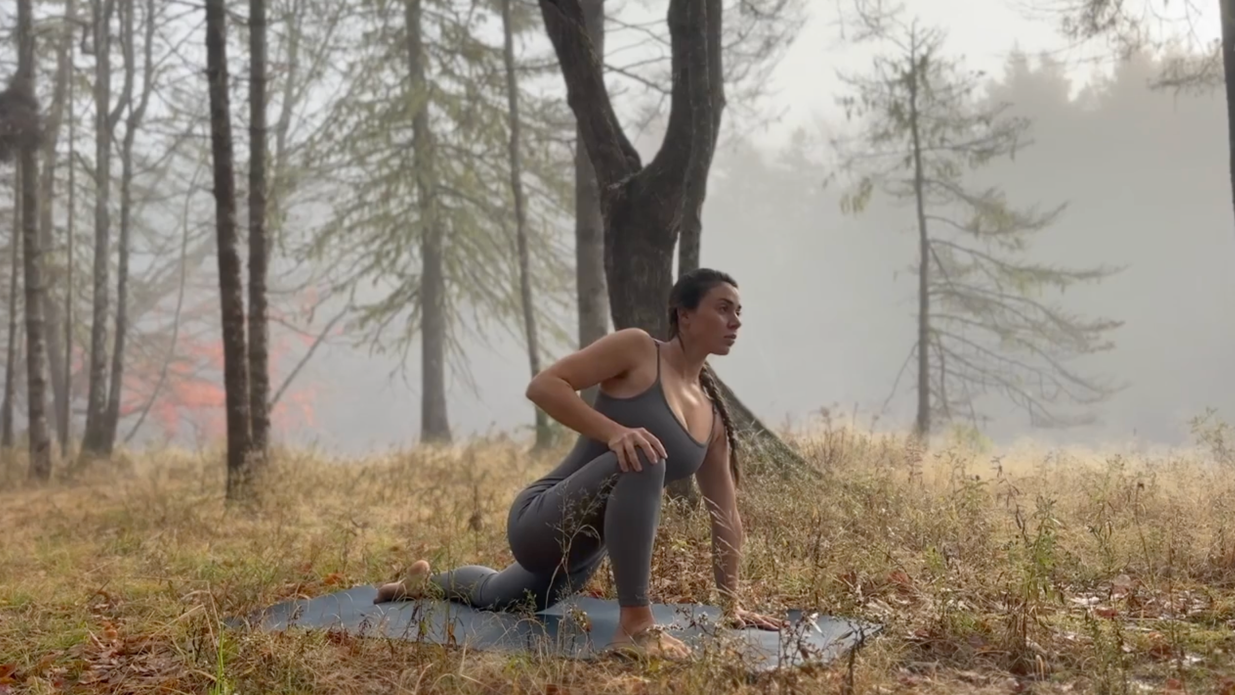 Teacher Emily Baltzer in the low lunge exercise