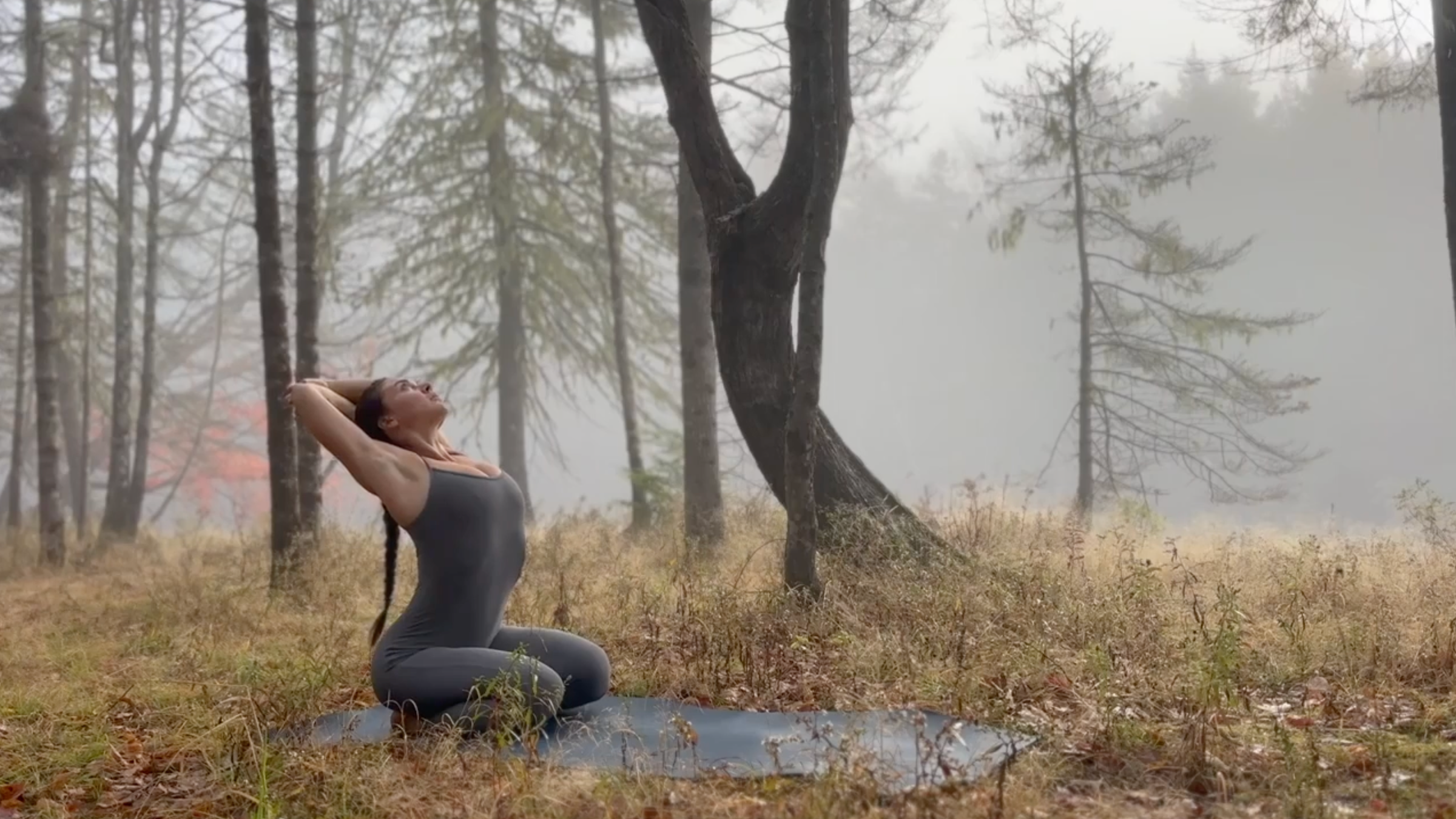 Teacher Emily Baltzer in a back kneeling position