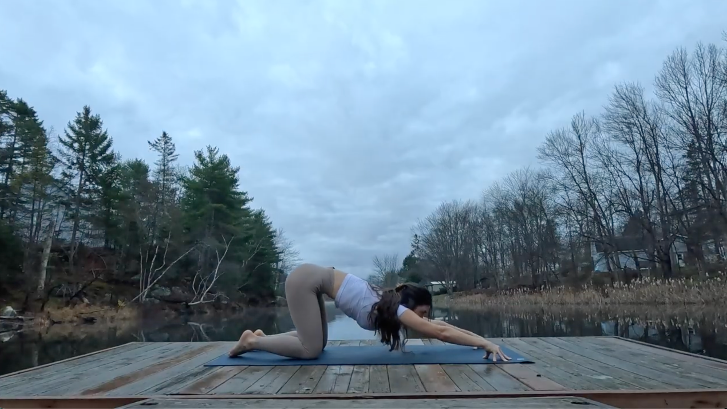 Teacher Emily Baltzer in Puppy Pose, part of her morning yoga routine