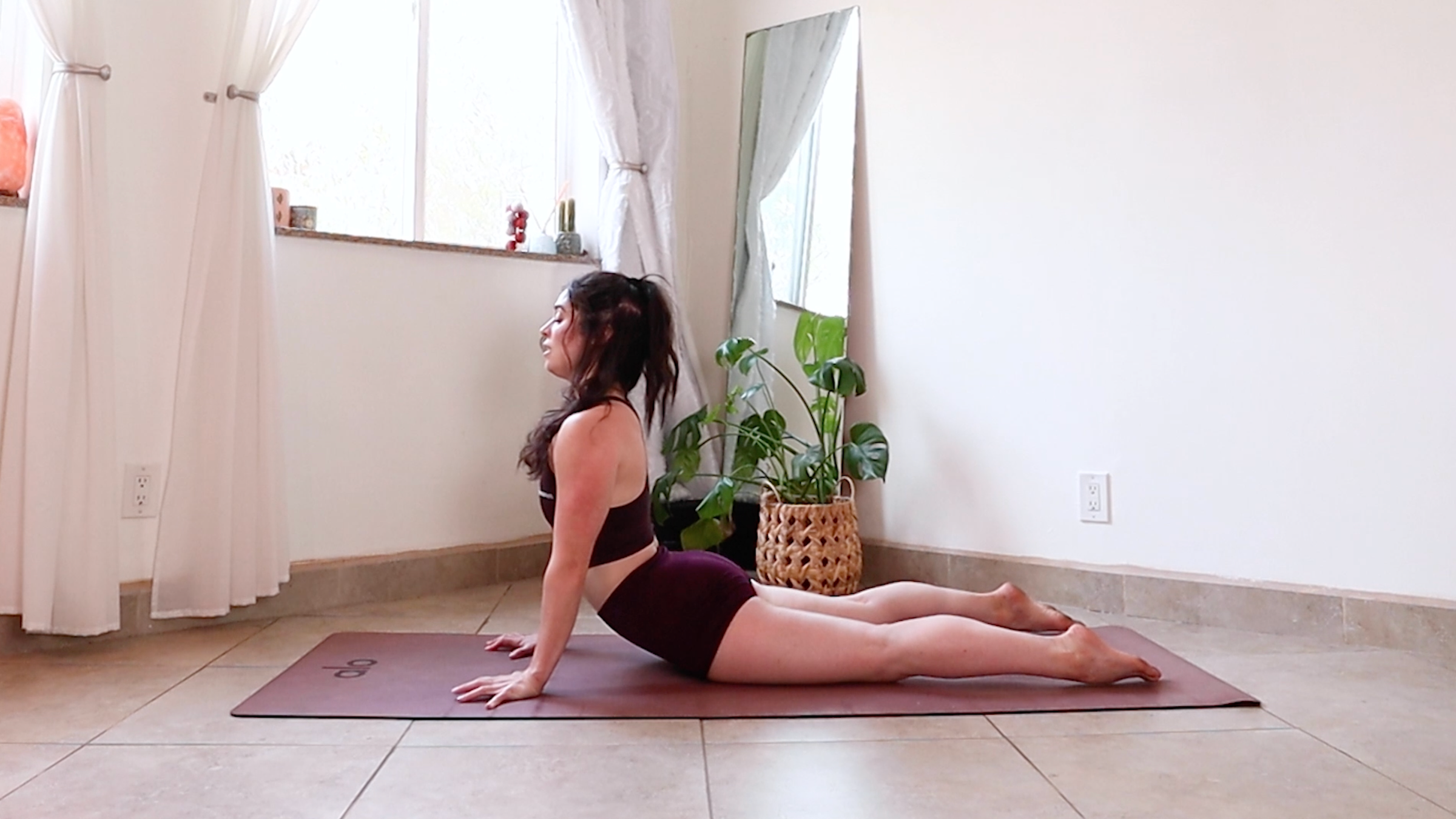 Yoga teacher Daria Legrand in cobra pose