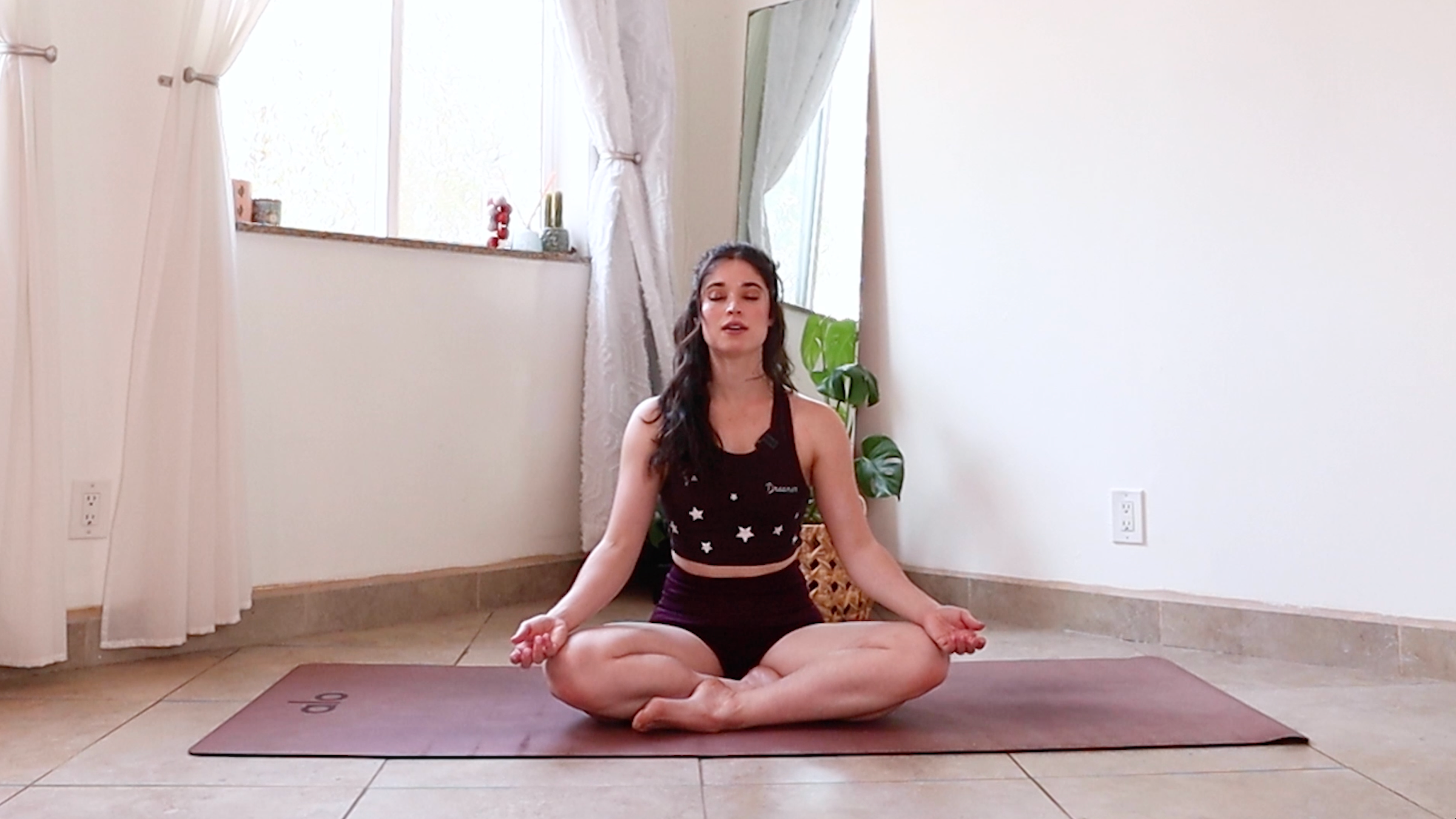 Yoga teacher Daria Legrand in Easy Pose, part of her yoga practice to reset the mind and body