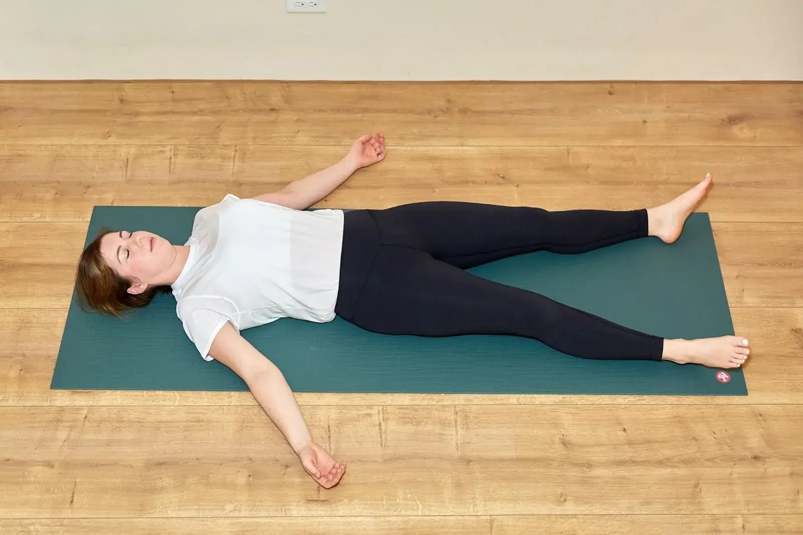 Yoga teacher Katie McGrath in Corpse Pose
