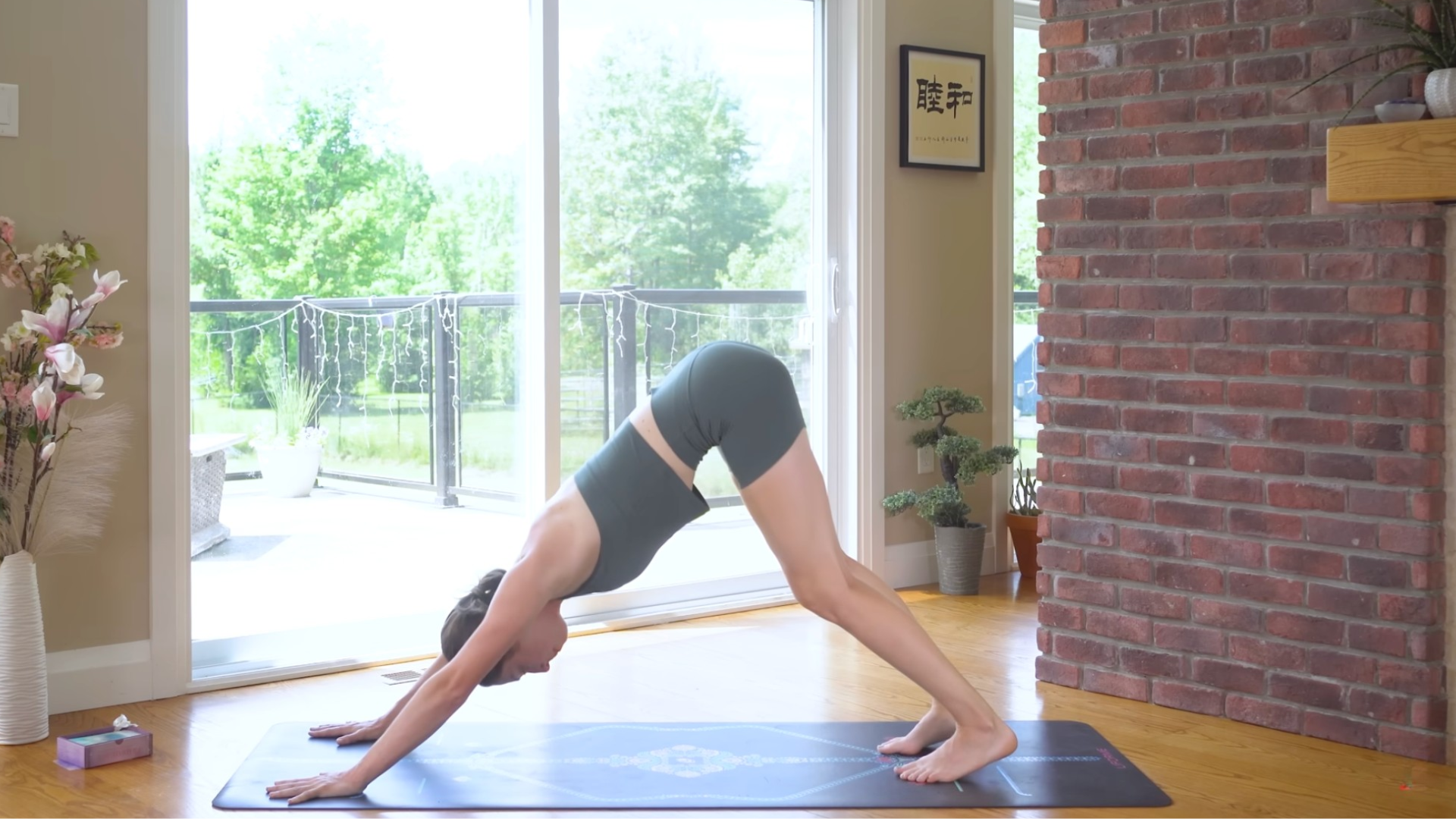 Woman on a mat in Downward-Facing Dog or Adho Mukha Svanasana
