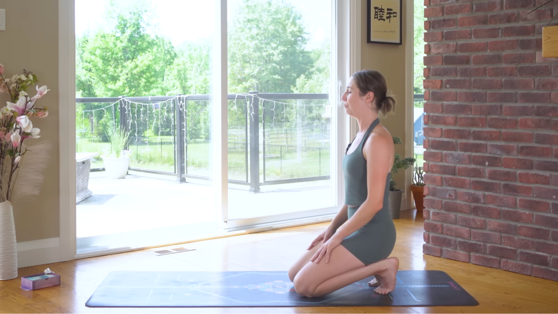 Woman kneeling and sitting back on her heels with her toes tucked in a stretch for the plantar fascia known as Toe Squat