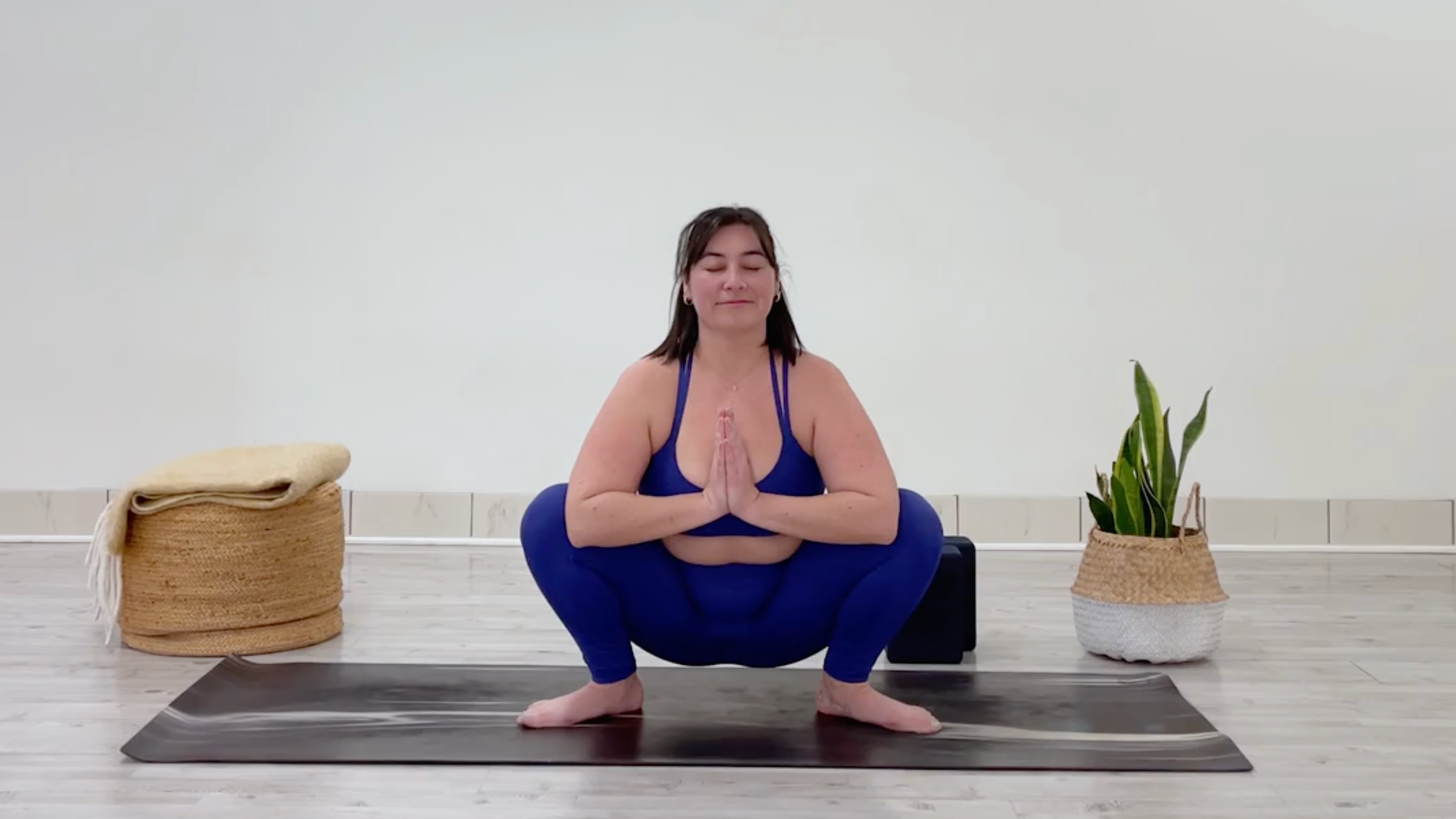 Teacher Taylor Lorenz in Garland Pose