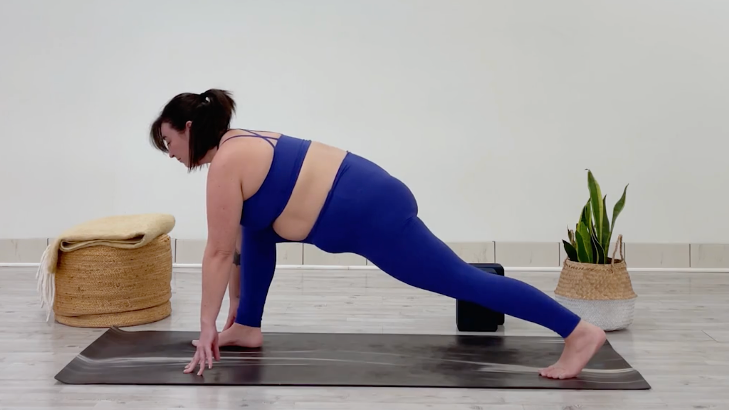 Yoga teacher Taylor Lorenz in Runner's Lunge, part of her morning yoga for tension flow
