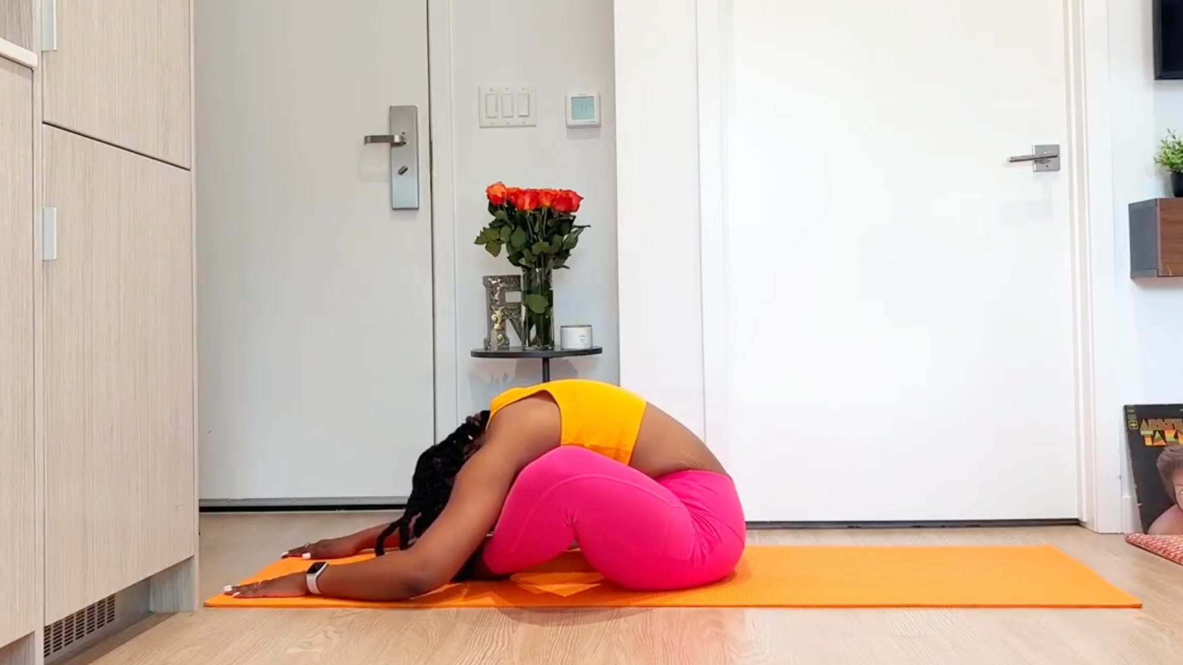 Yoga teacher practicing Bound Angle Pose 