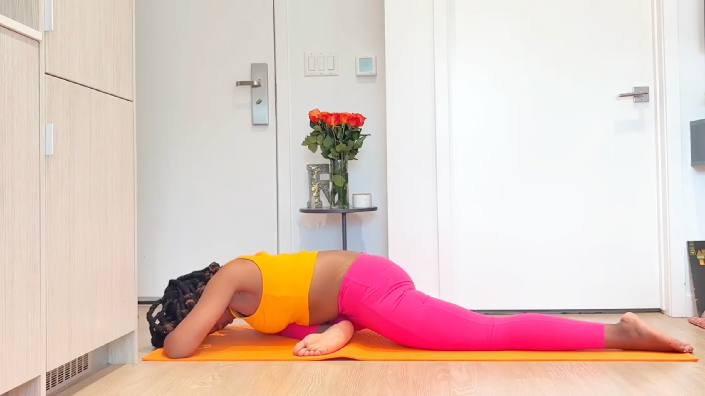 Yoga teacher practicing Pigeon Pose
