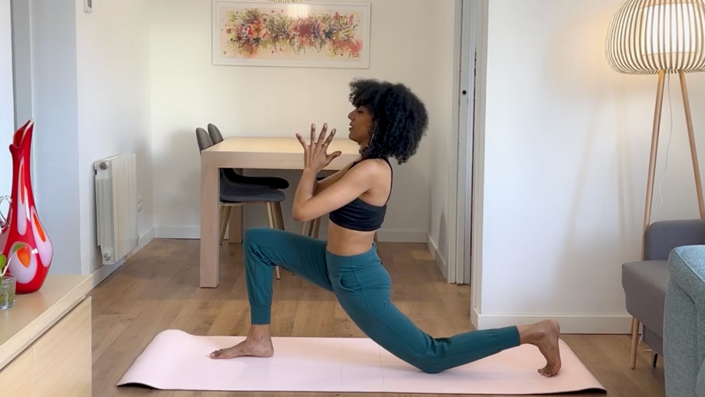 Yoga teacher practicing Low Lunge.