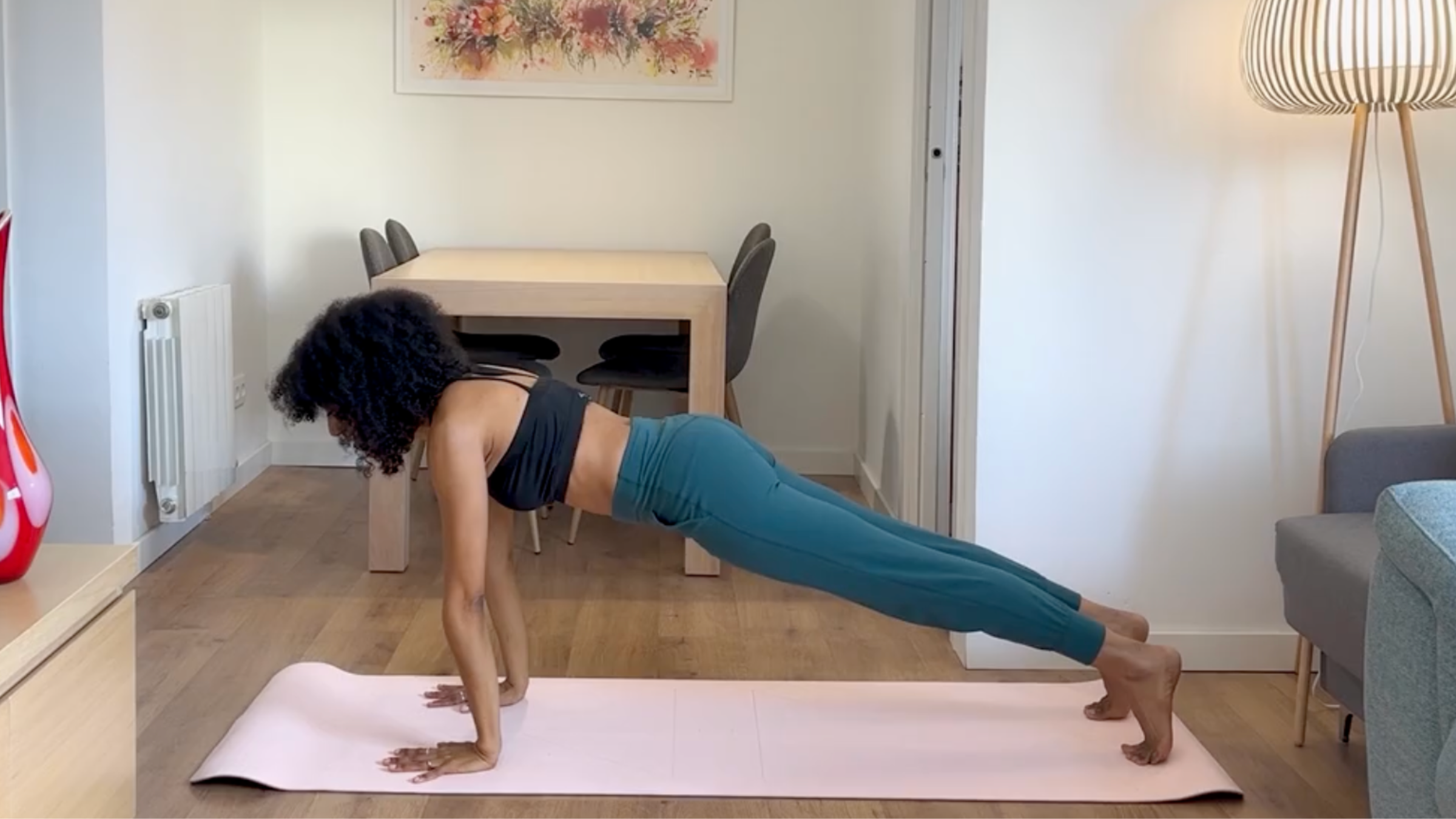 Yoga teacher practicing Plank