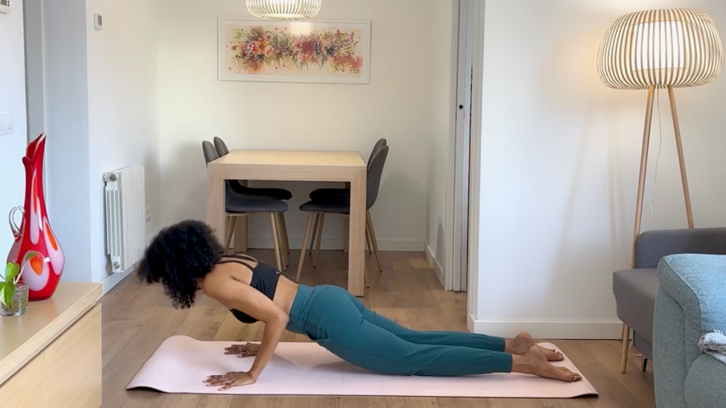 Yoga teacher practicing Knees-Down Chaturanga.