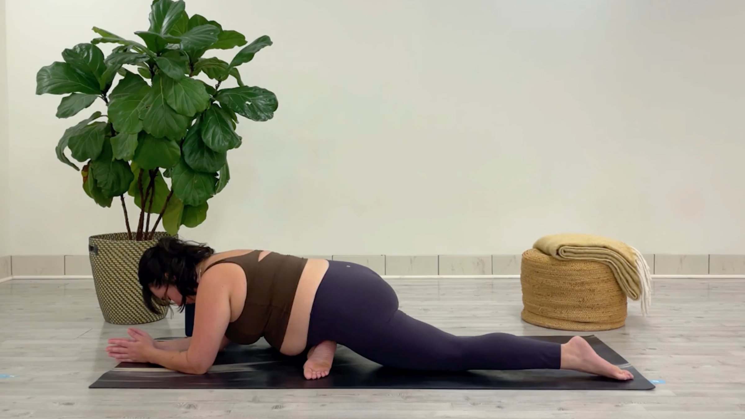 Teacher Taylor Lorenz in Pigeon Pose