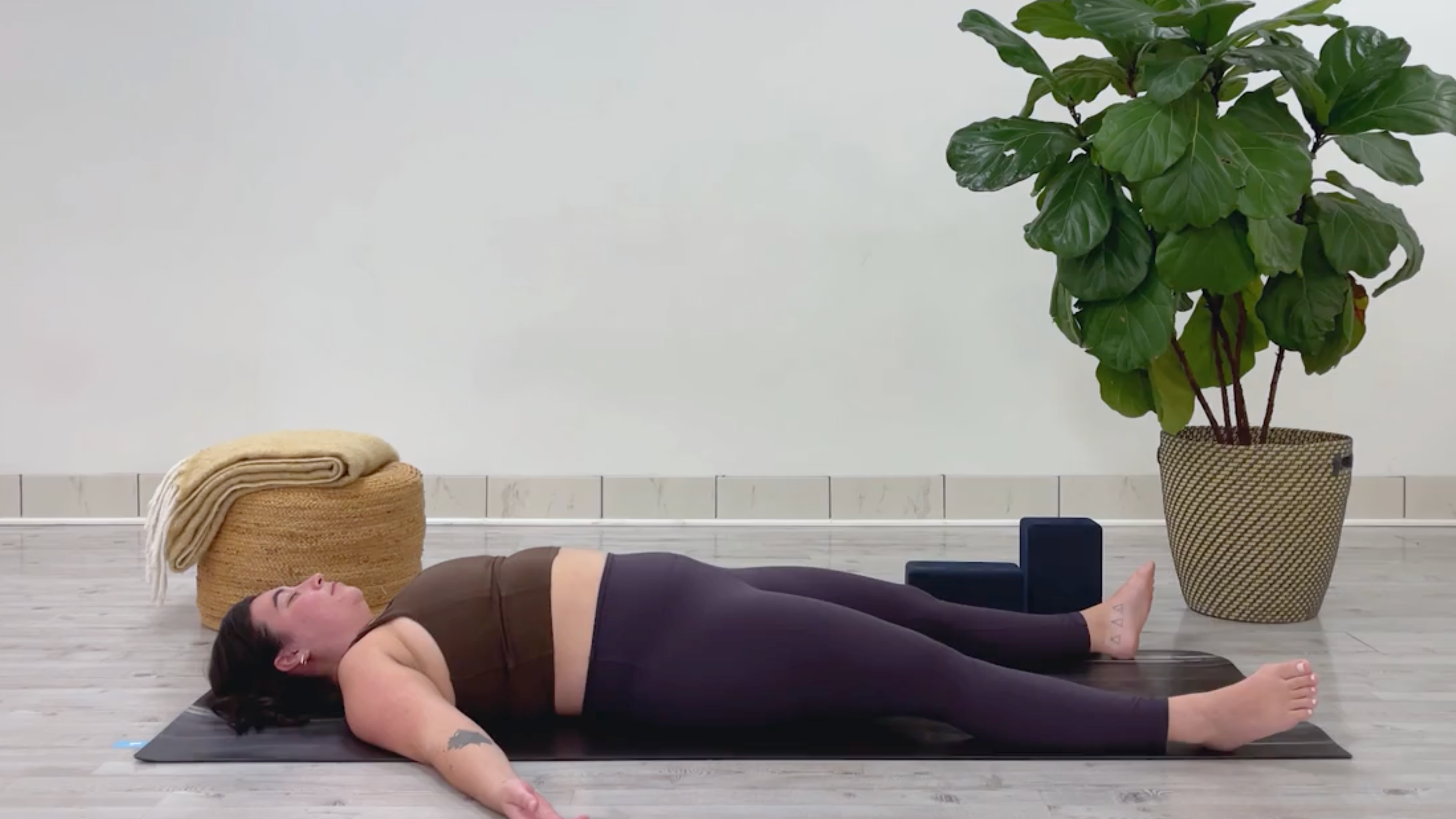 Yoga teacher Taylor Lorenz in Savasana