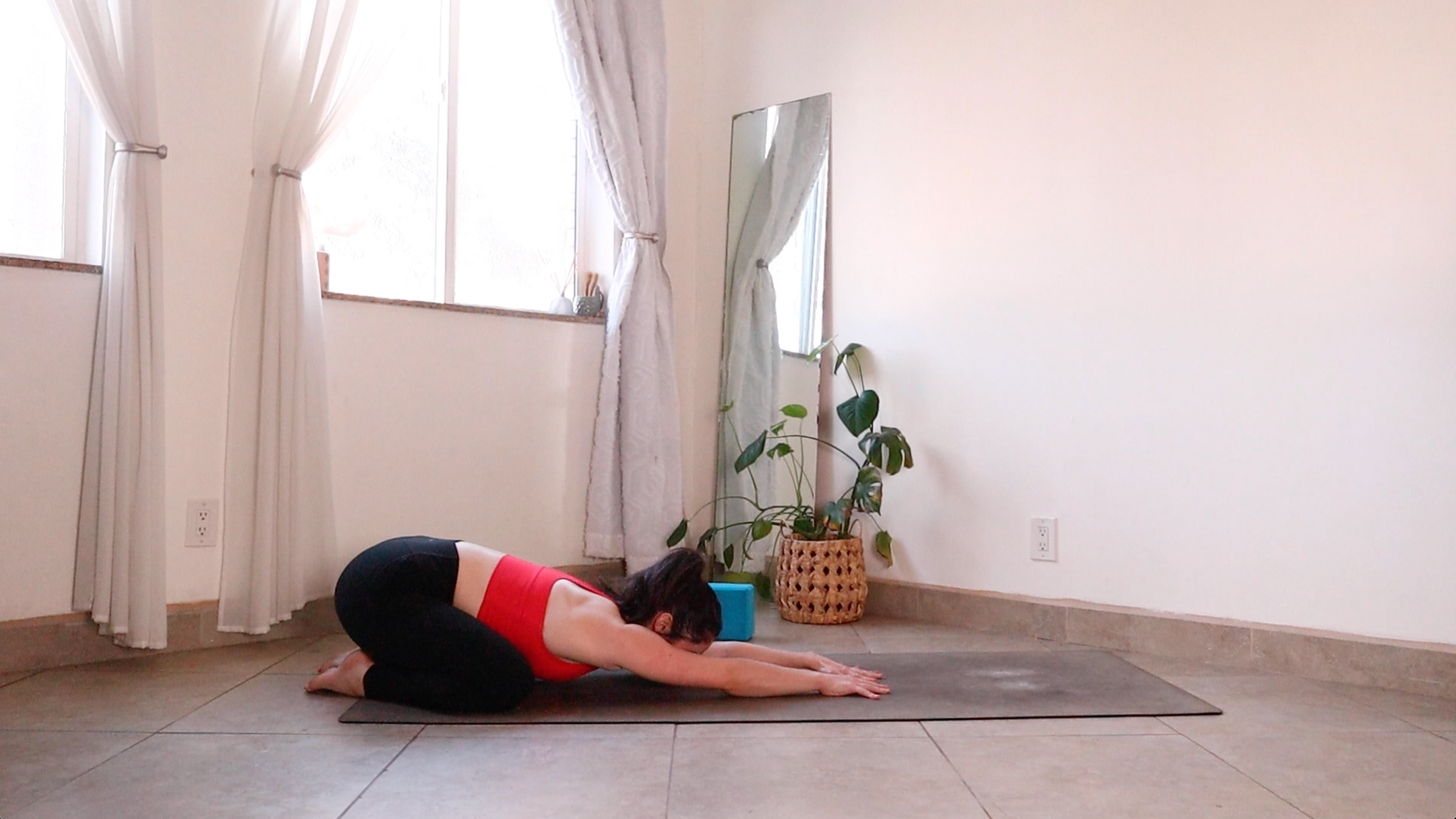 Yoga teacher Daria LeGrand in Child's Pose