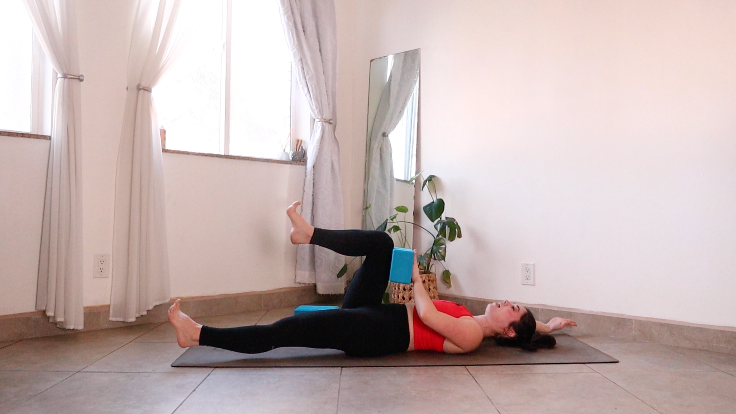 Yoga teacher Daria LeGrand in Dead Bug Variation