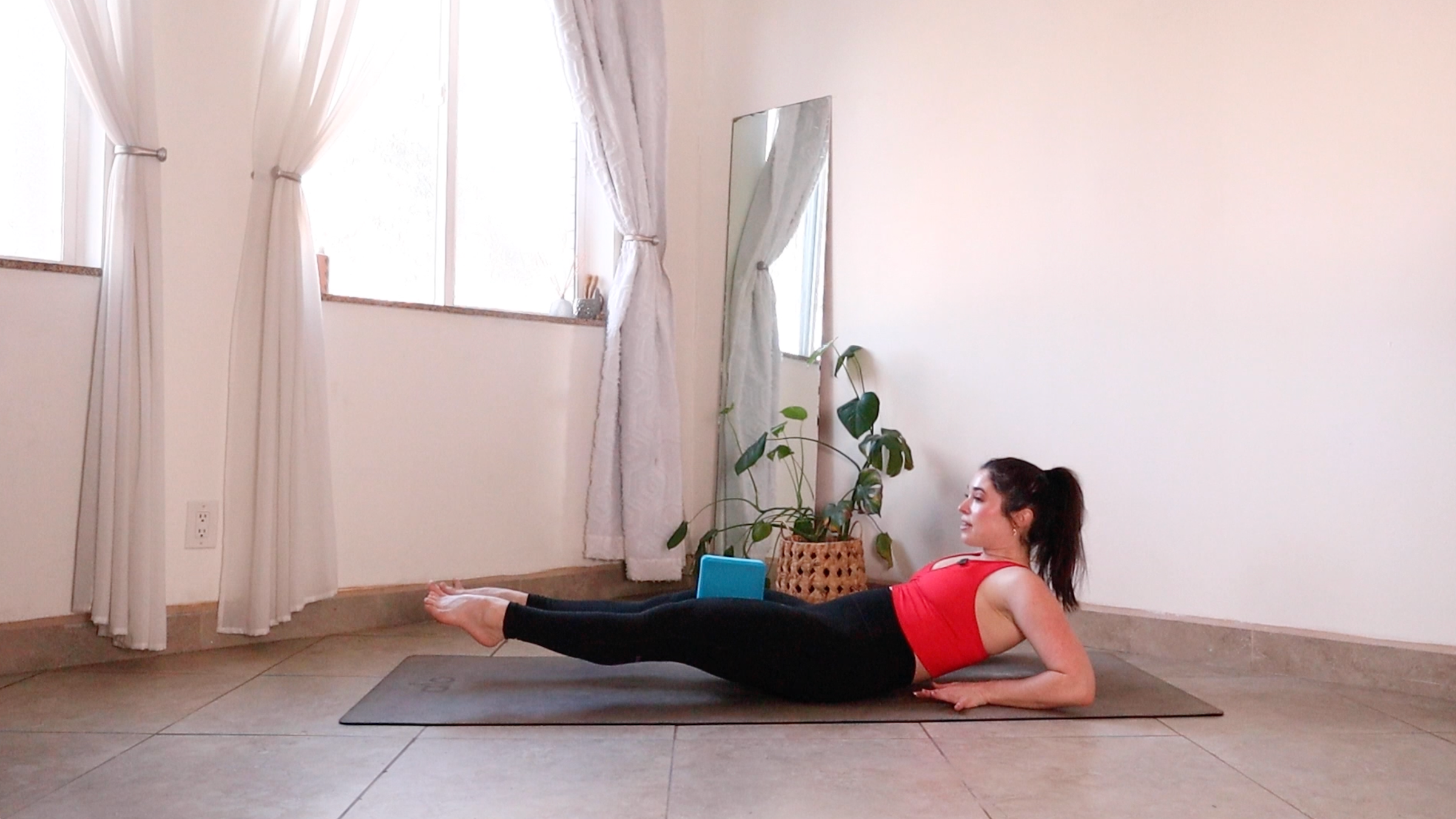 Yoga teacher Daria LeGrand in Low Boat variation, one of her core strength exercises
