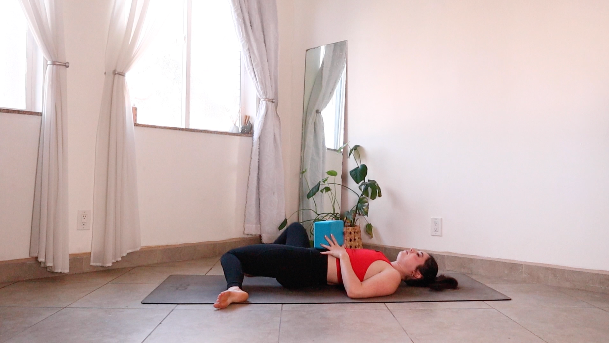 Yoga teacher Daria LeGrand in Windshield Wipers, one of her core strength exercises