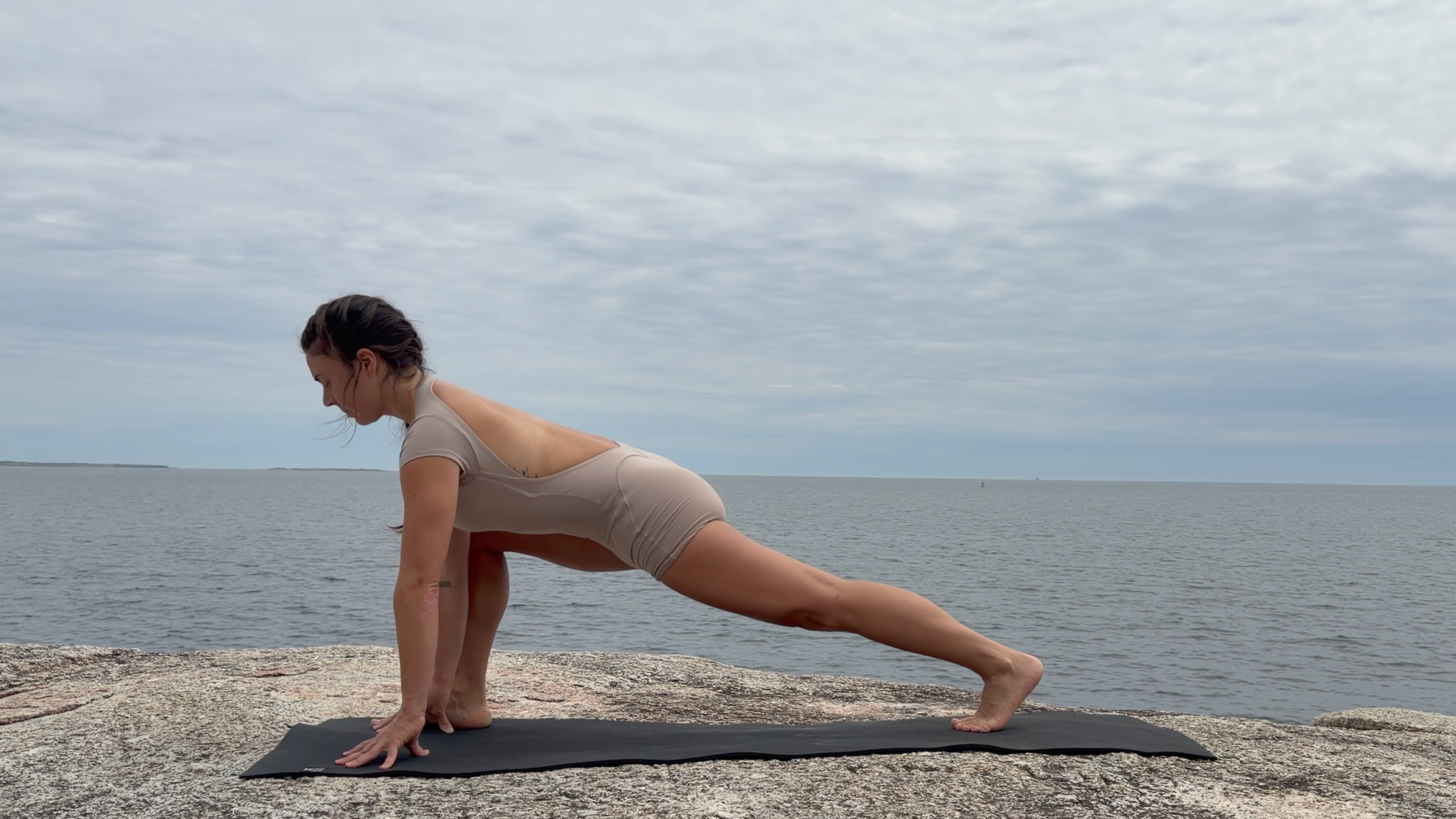 Teacher Emily Baltzer in High Lizard Lunge