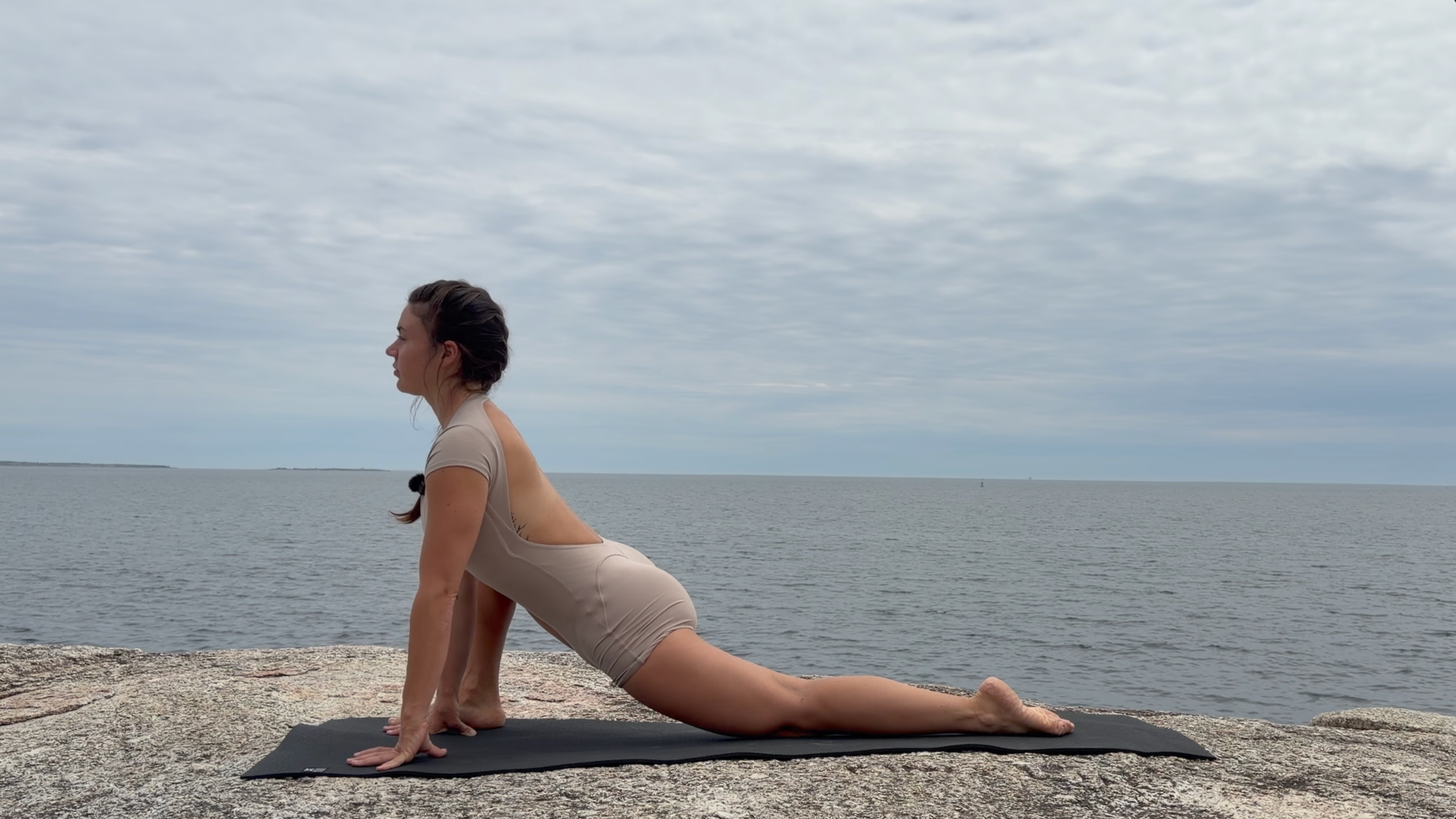 Teacher Emily Baltzer in Lizard Pose