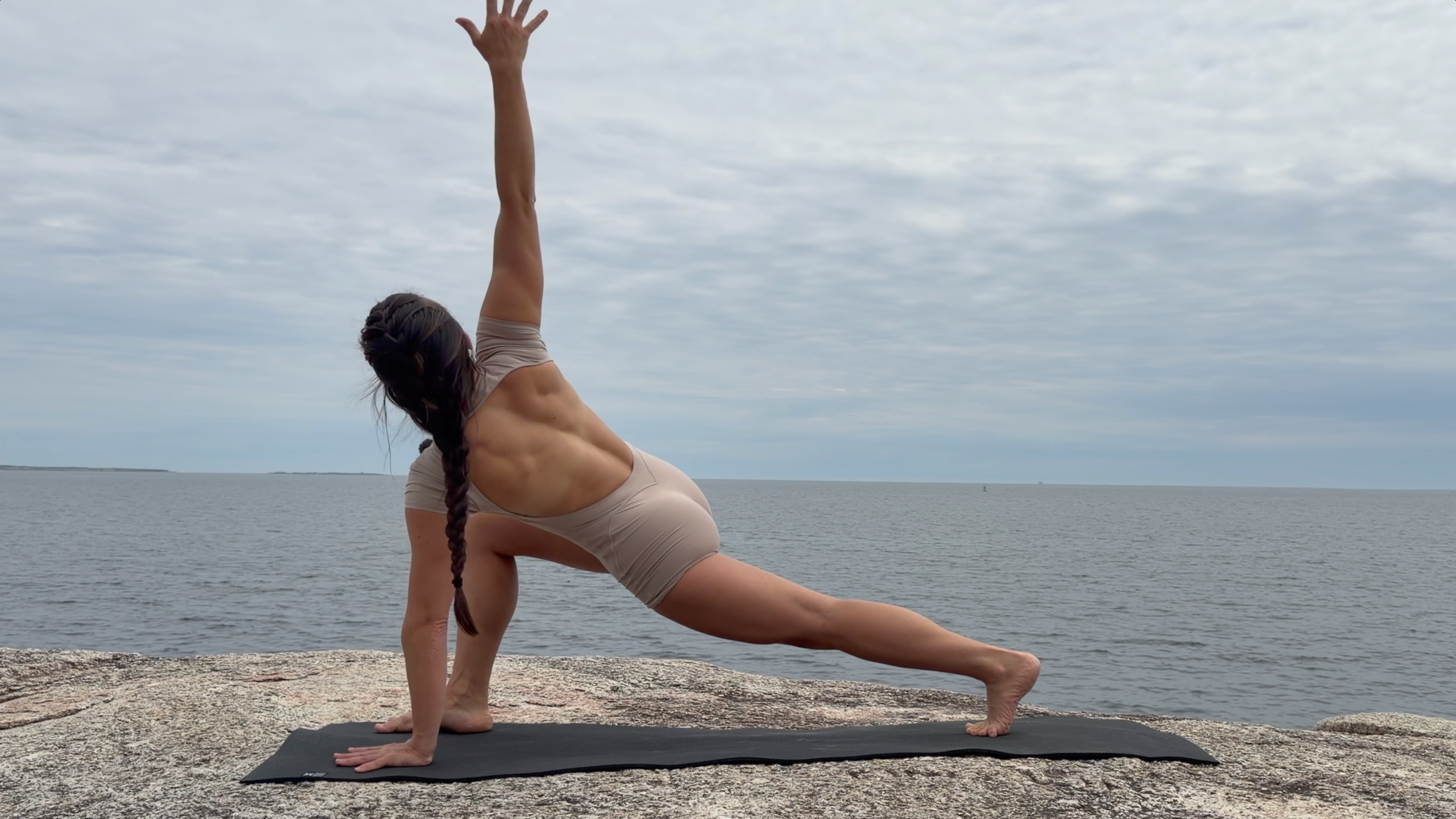 Teacher Emily Baltzer in High Twisting Lunge