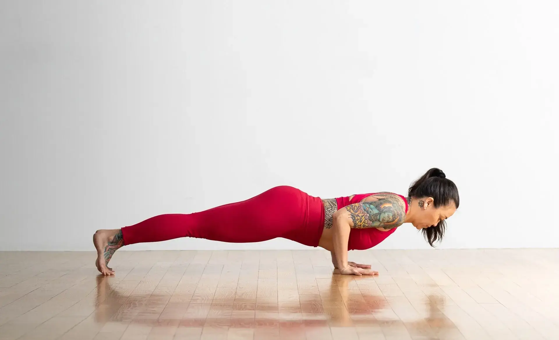 Woman doing her favorite strength training exercises in Chaturanga