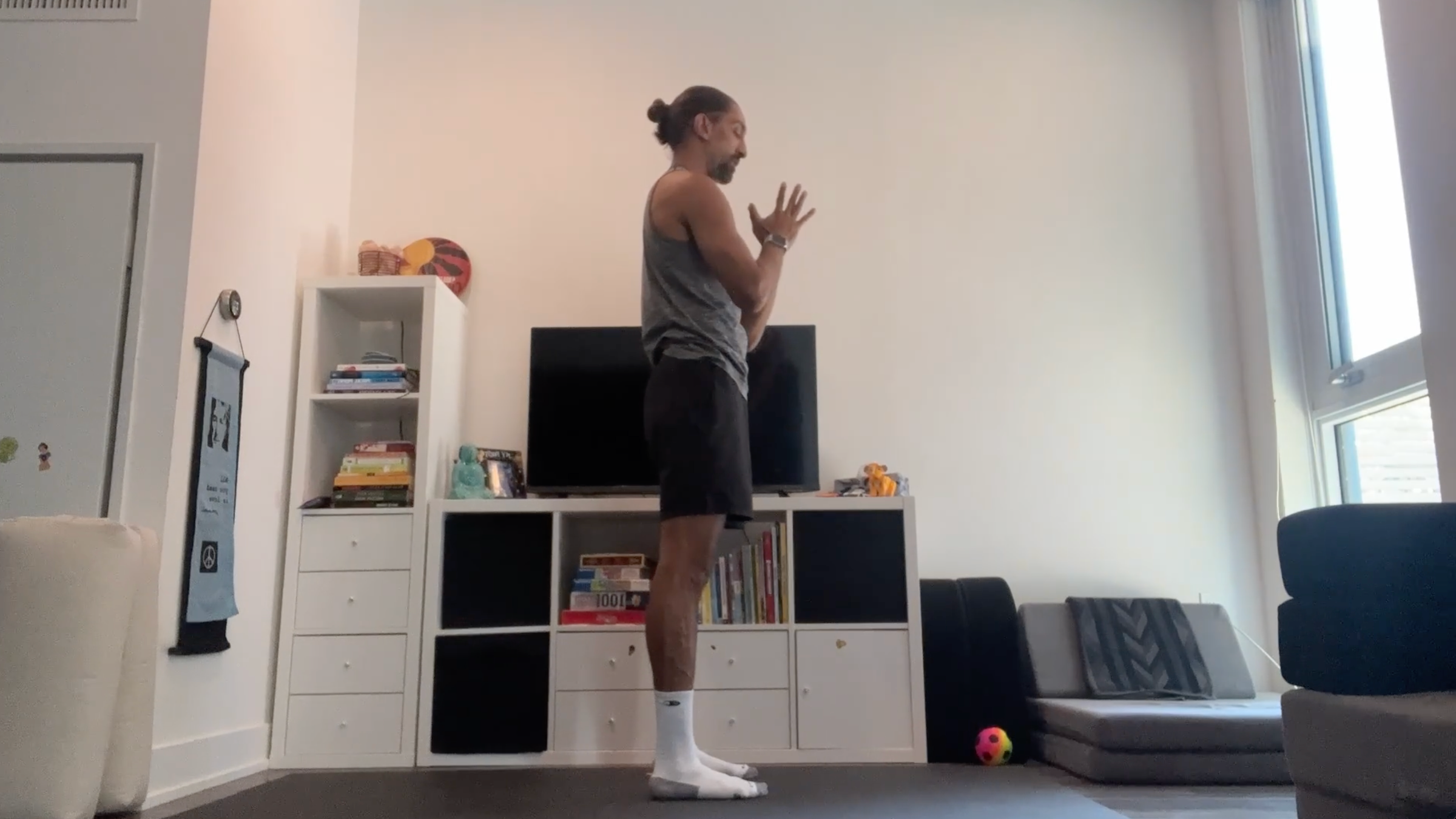 Yoga teacher Jaffer Hussain in Mountain Pose, part of his yoga for tech neck practice