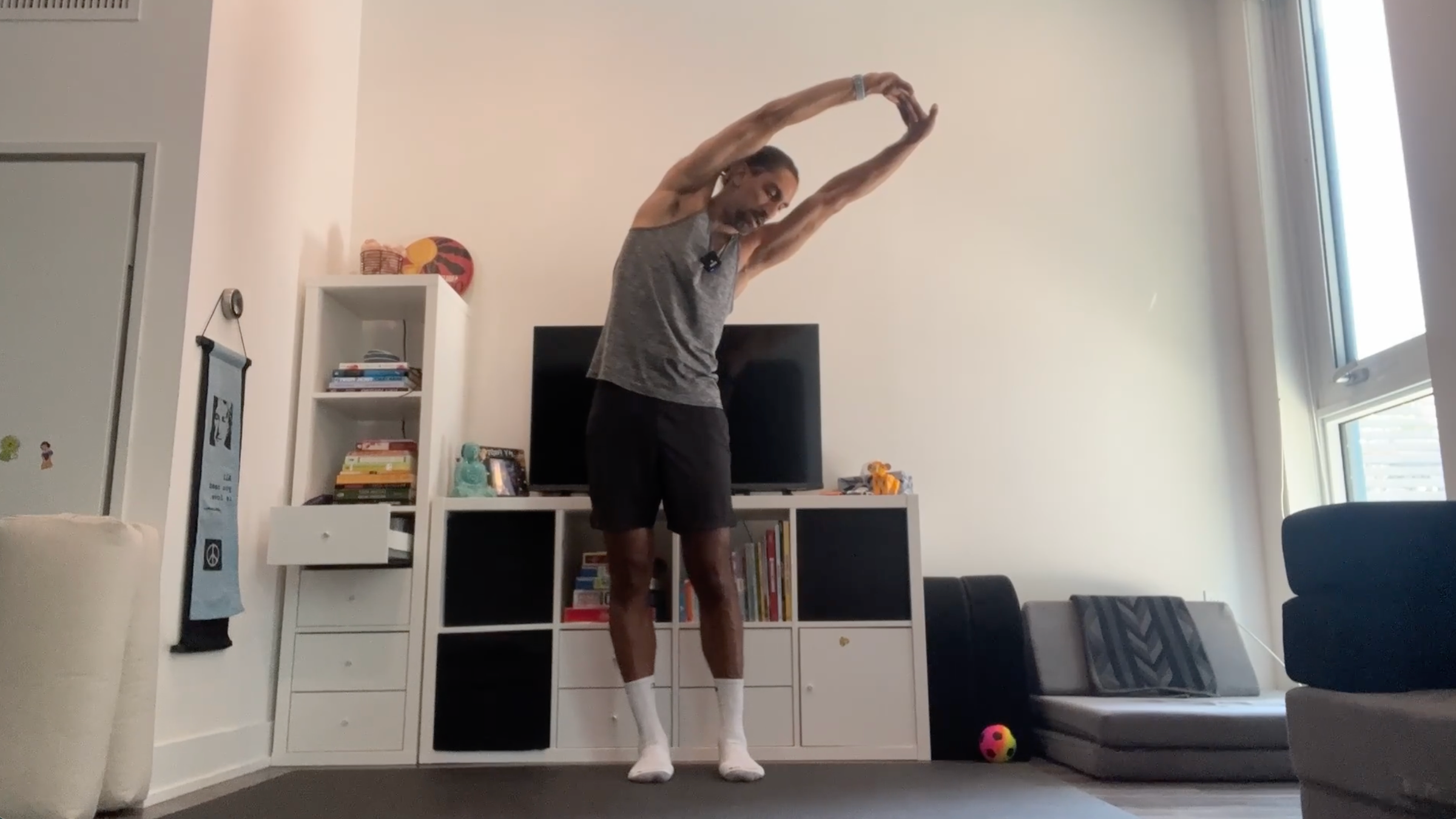 Yoga teacher Jaffer Hussain in Standing Side Stretch, part of his yoga for tech neck practice