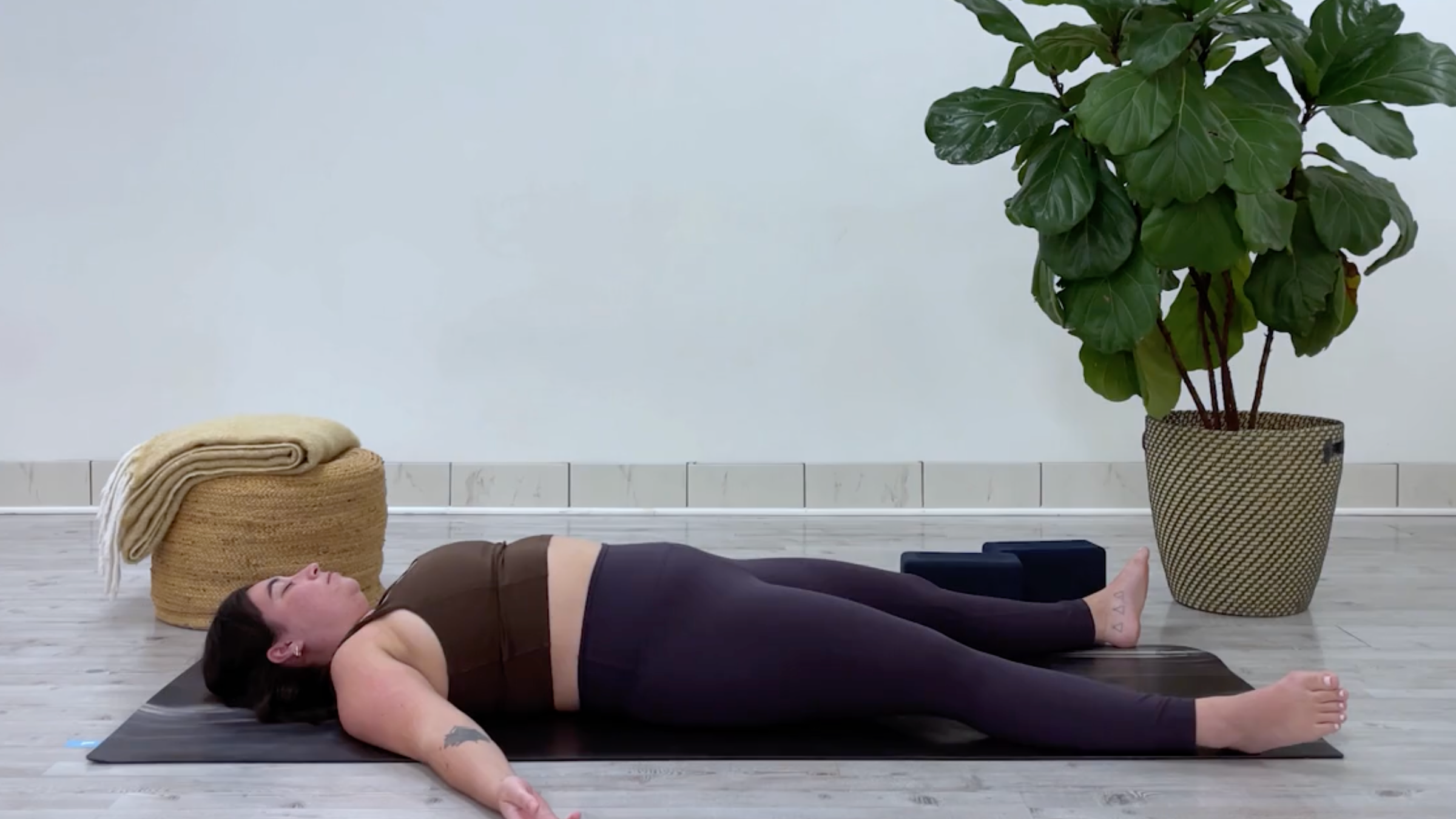 Teacher Taylor Lorenz in Savasana