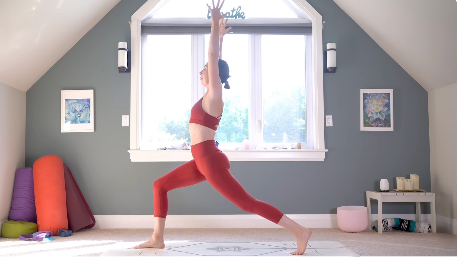 Yoga With Kassandra in High Lunge with her arms alongside her head