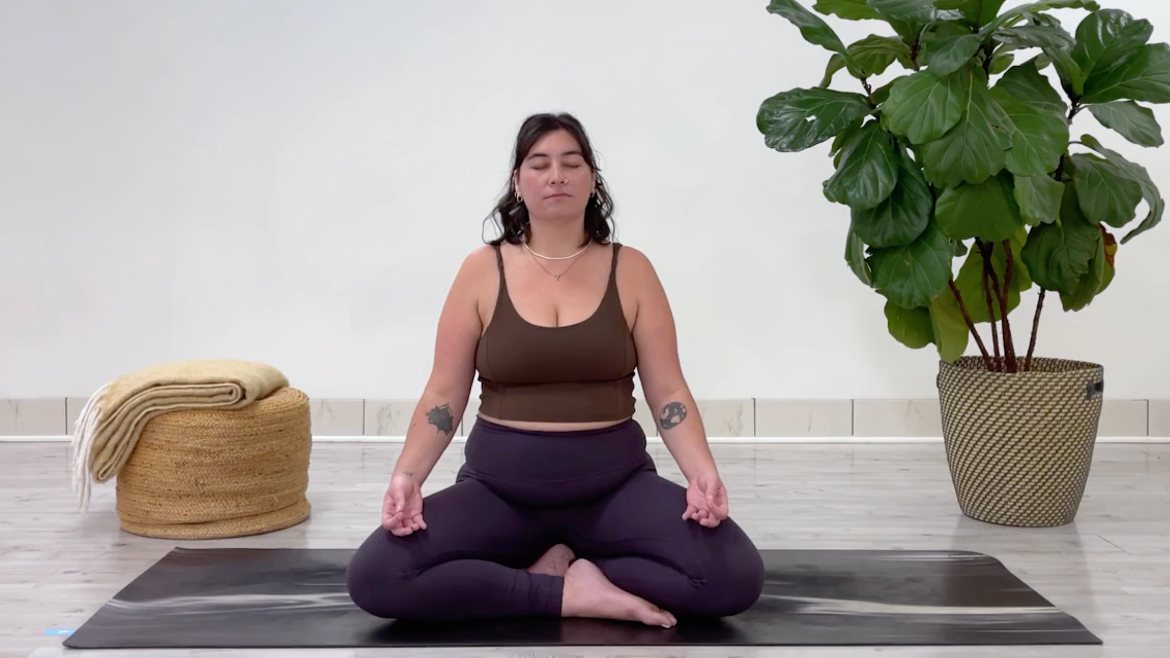 Yoga teacher Taylor Lorenz closing a breathwork session