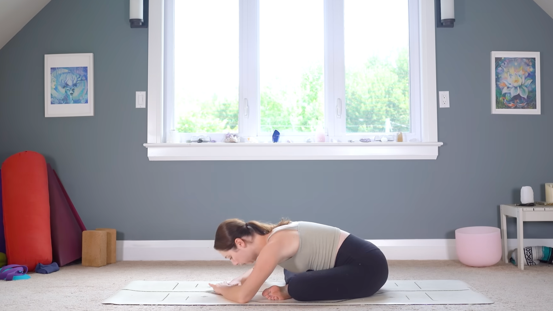 Woman leaning forward while sitting cross-legged